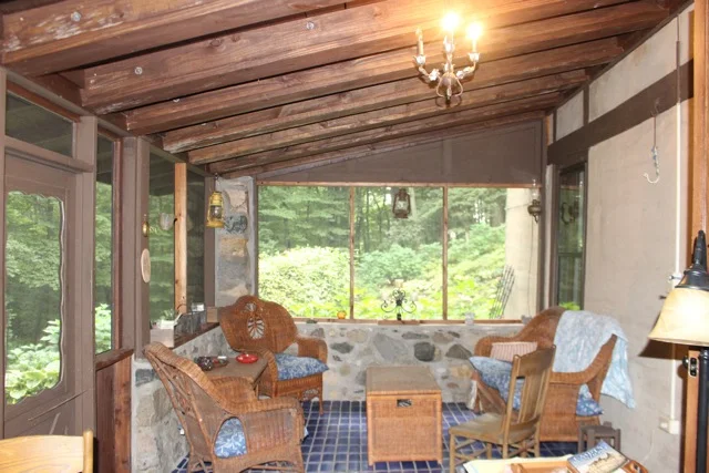 Interior of the fieldstone porch where we sat comfortably and chatted some more...