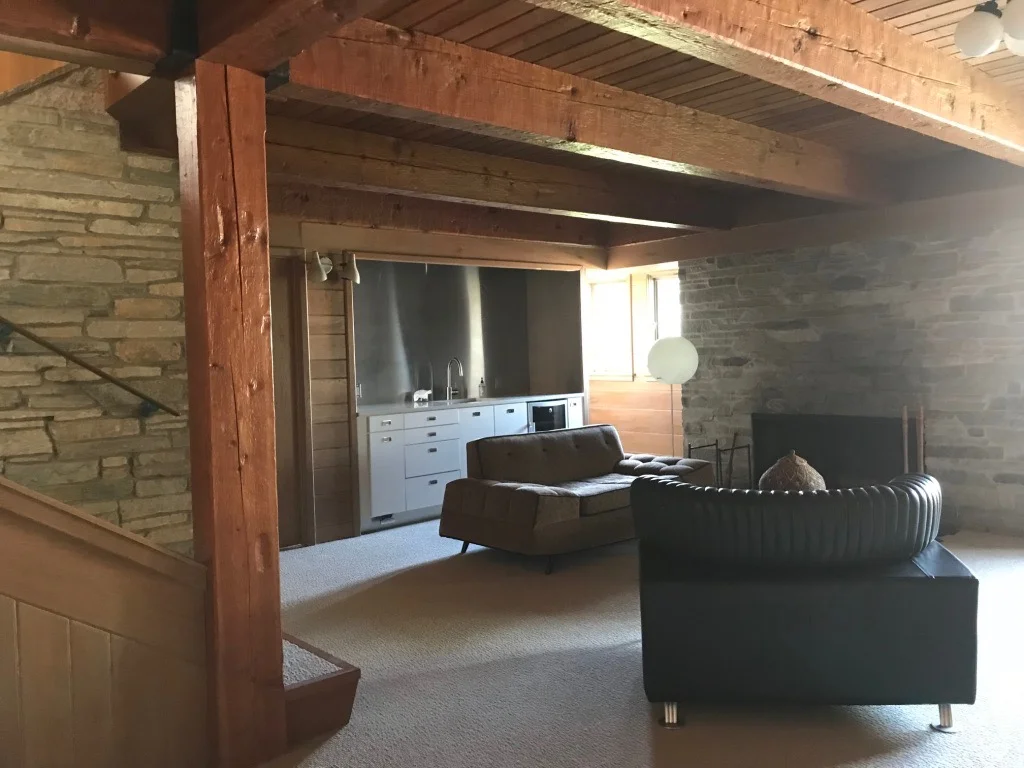 FAMILY ROOM WITH HAND-HEWN BEAMS