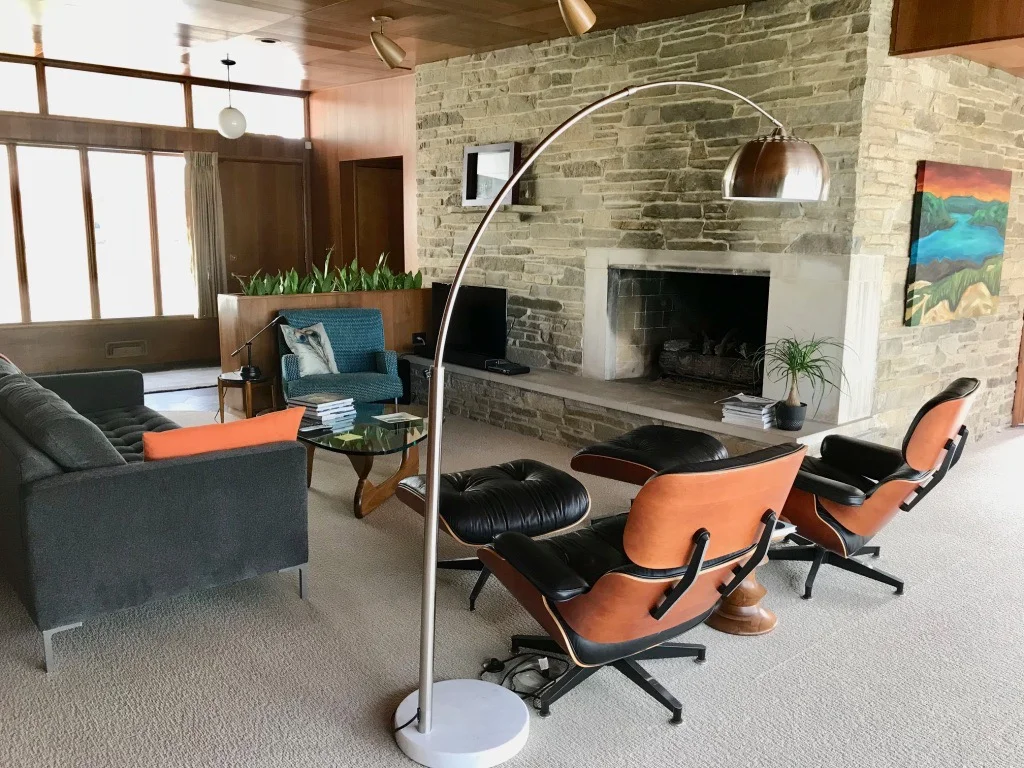 HINT OF THE DINING ROOM BEYOND LIVING ROOM