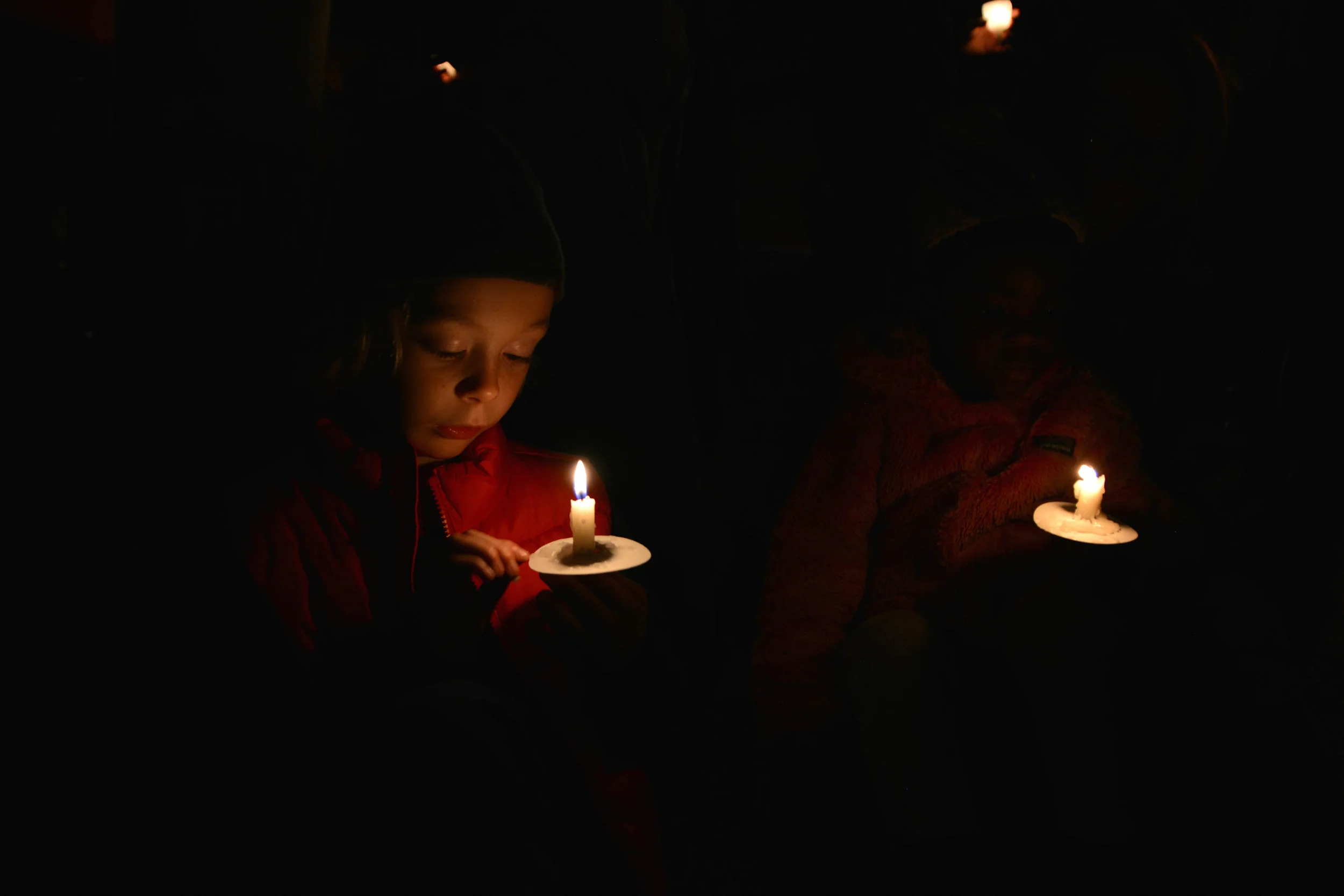  A child in Carroll Gardens, Brooklyn holds a candle at a vigil for victims of terrorist attacks in Paris and Beirut on Nov. 14, 2015.  DNAinfo/Nikhita Venugopal 
