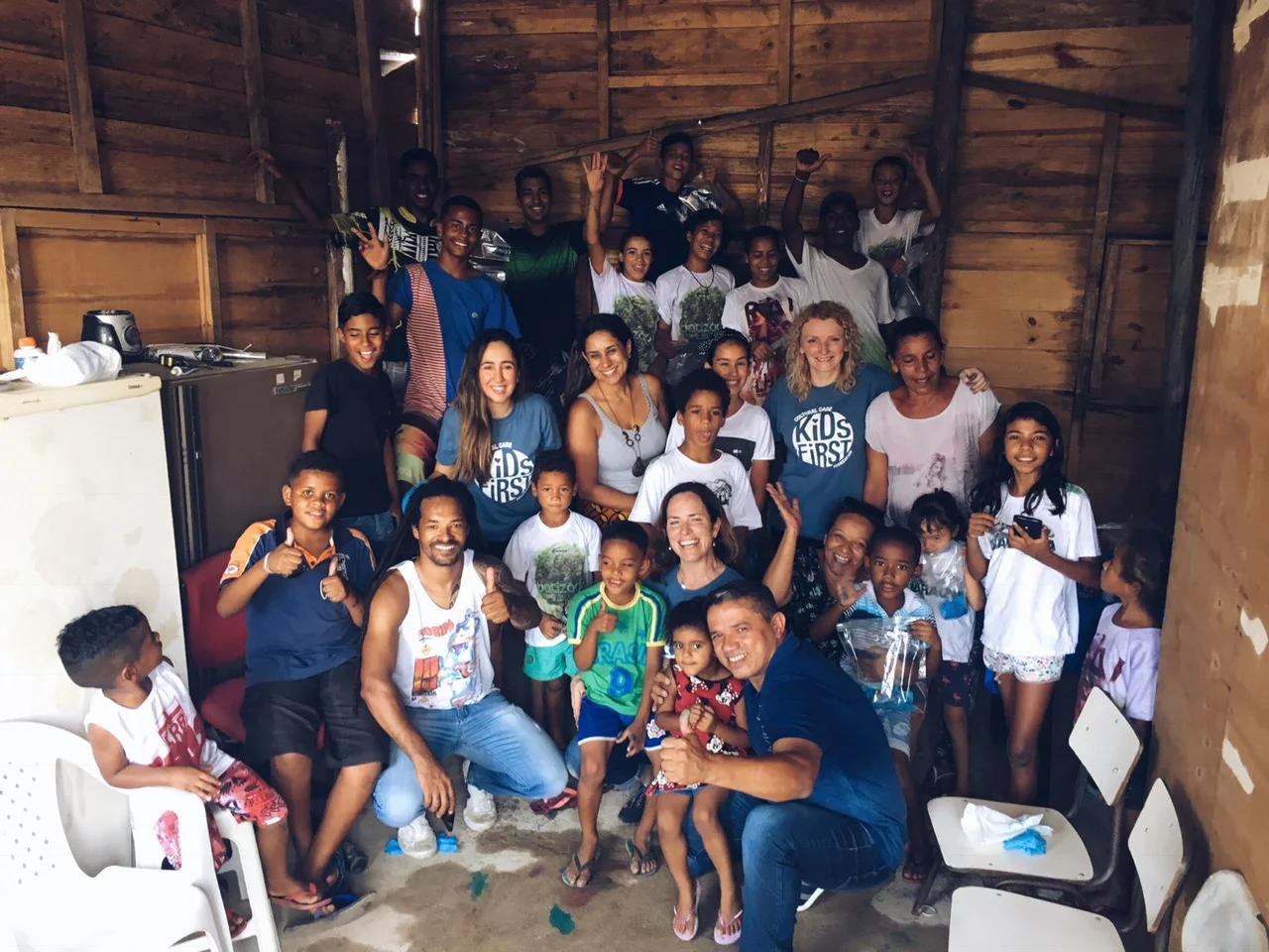The Kids First team with the children of the favela