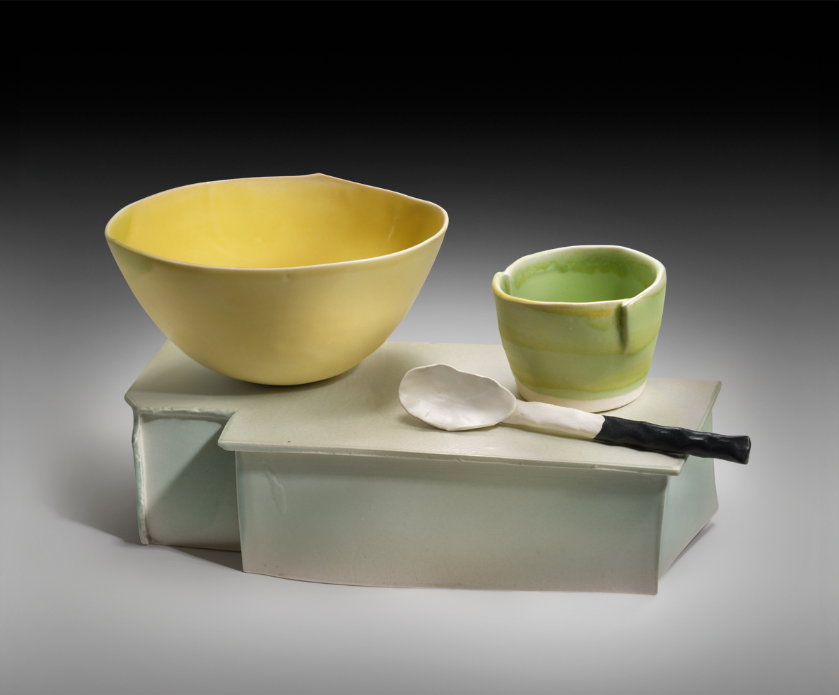 Two Bowls With Spoons On Base