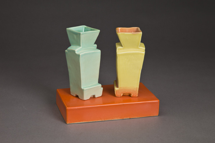 Two Faceted Vases On Base