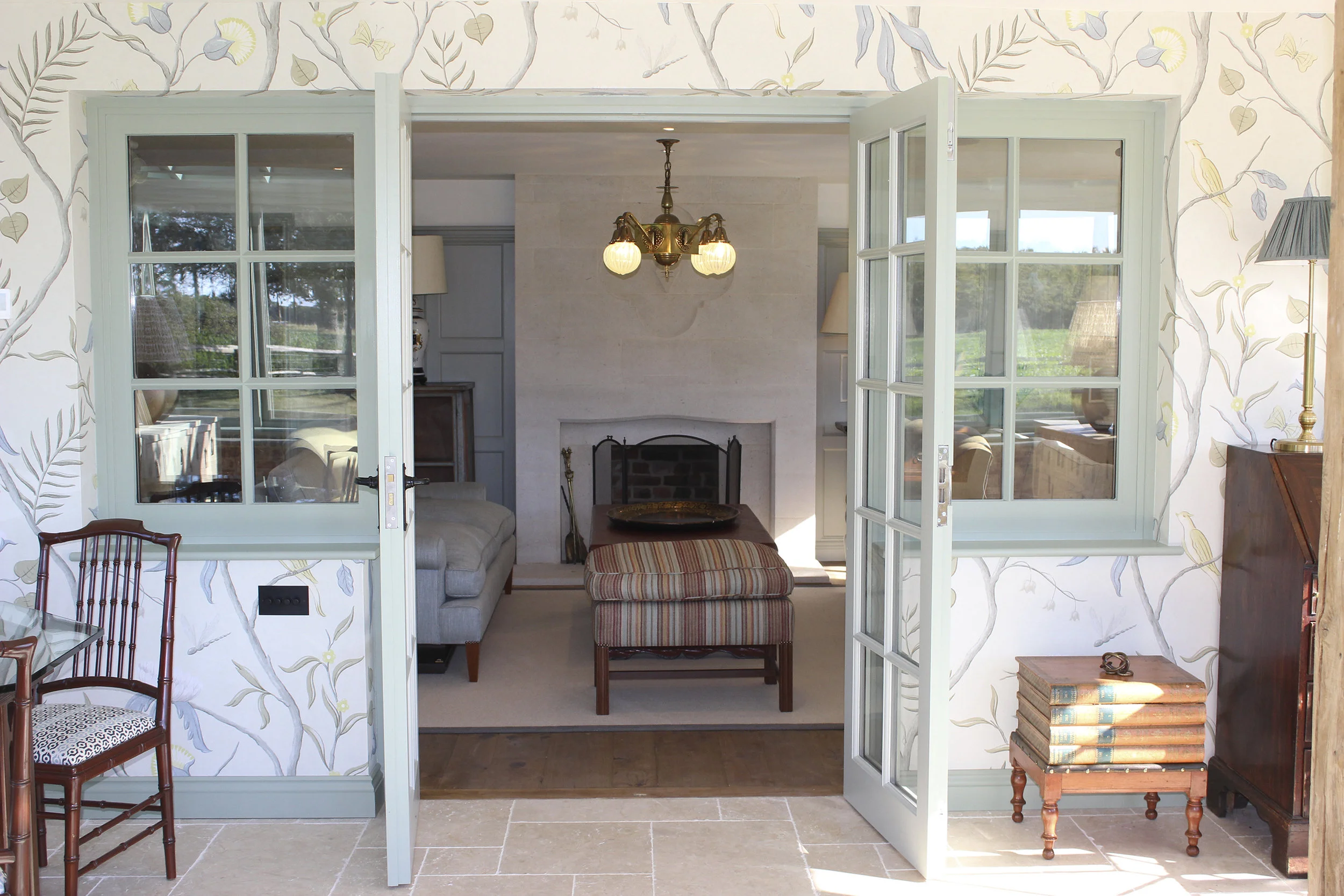View from conservatory into drawing room showing the beautiful Lewis & Wood wallpaper