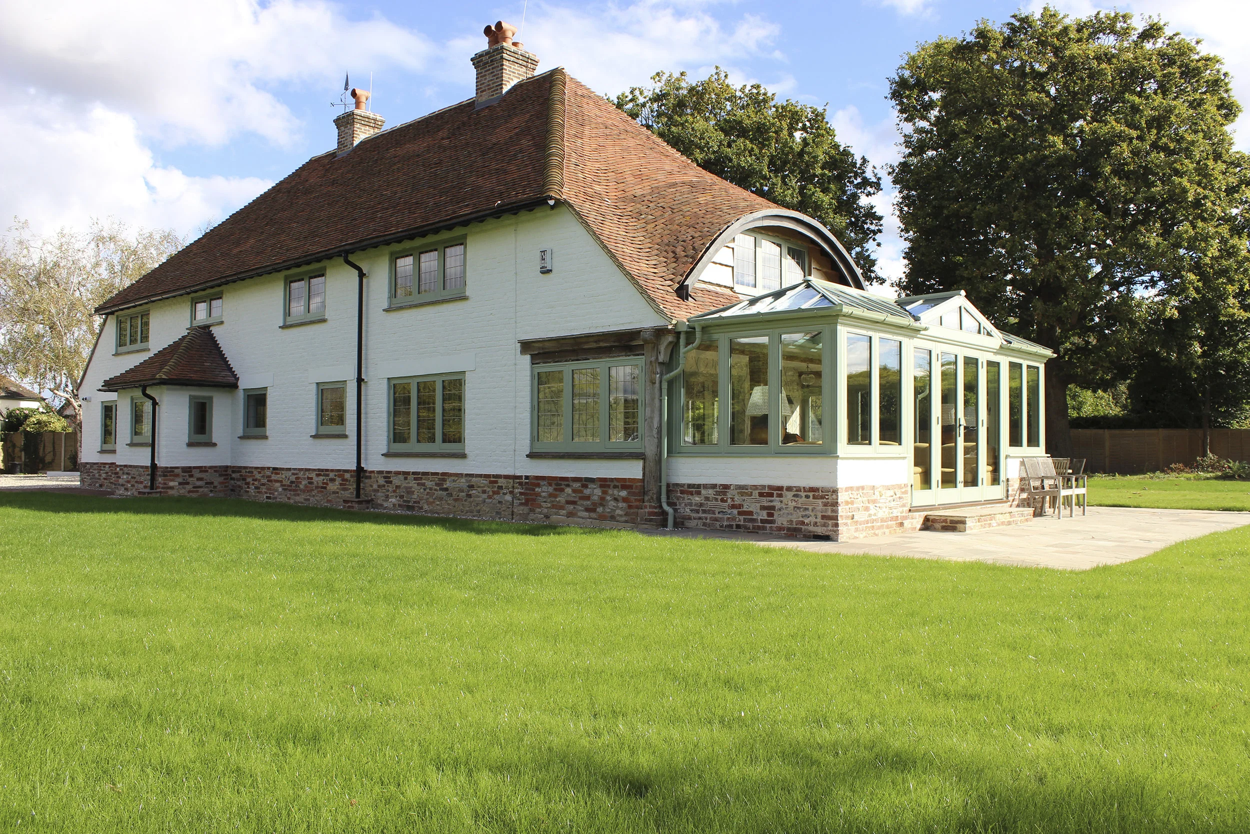 Joiner made hardwood windows and cast iron guttering to give a truly period feel. Beautiful lead guttering around reworked eybrow. All materials were carefully chosen to be in keeping with the area.