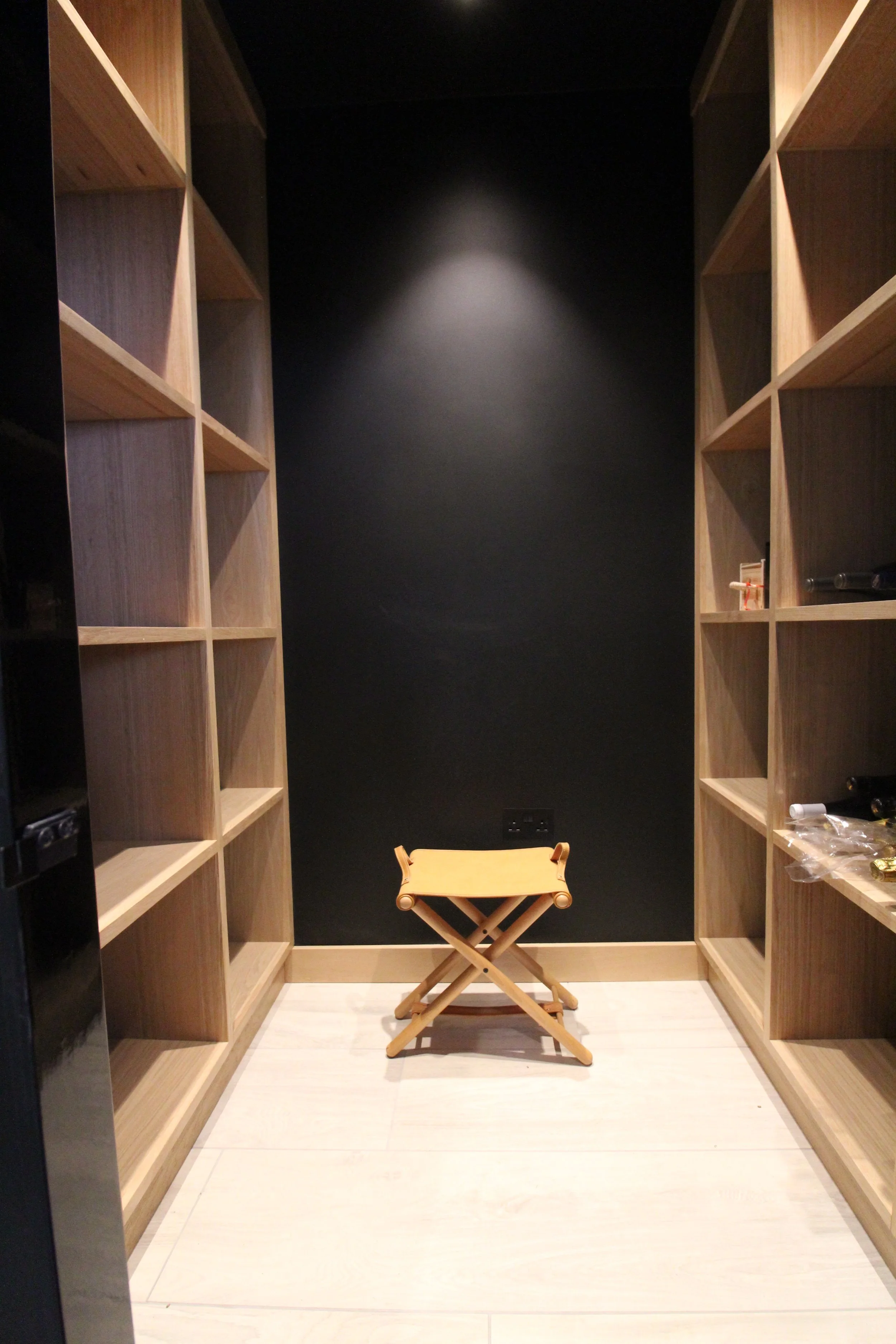 Joiner-made oak shelving can hold up to 400 bottles of wine or champagne.