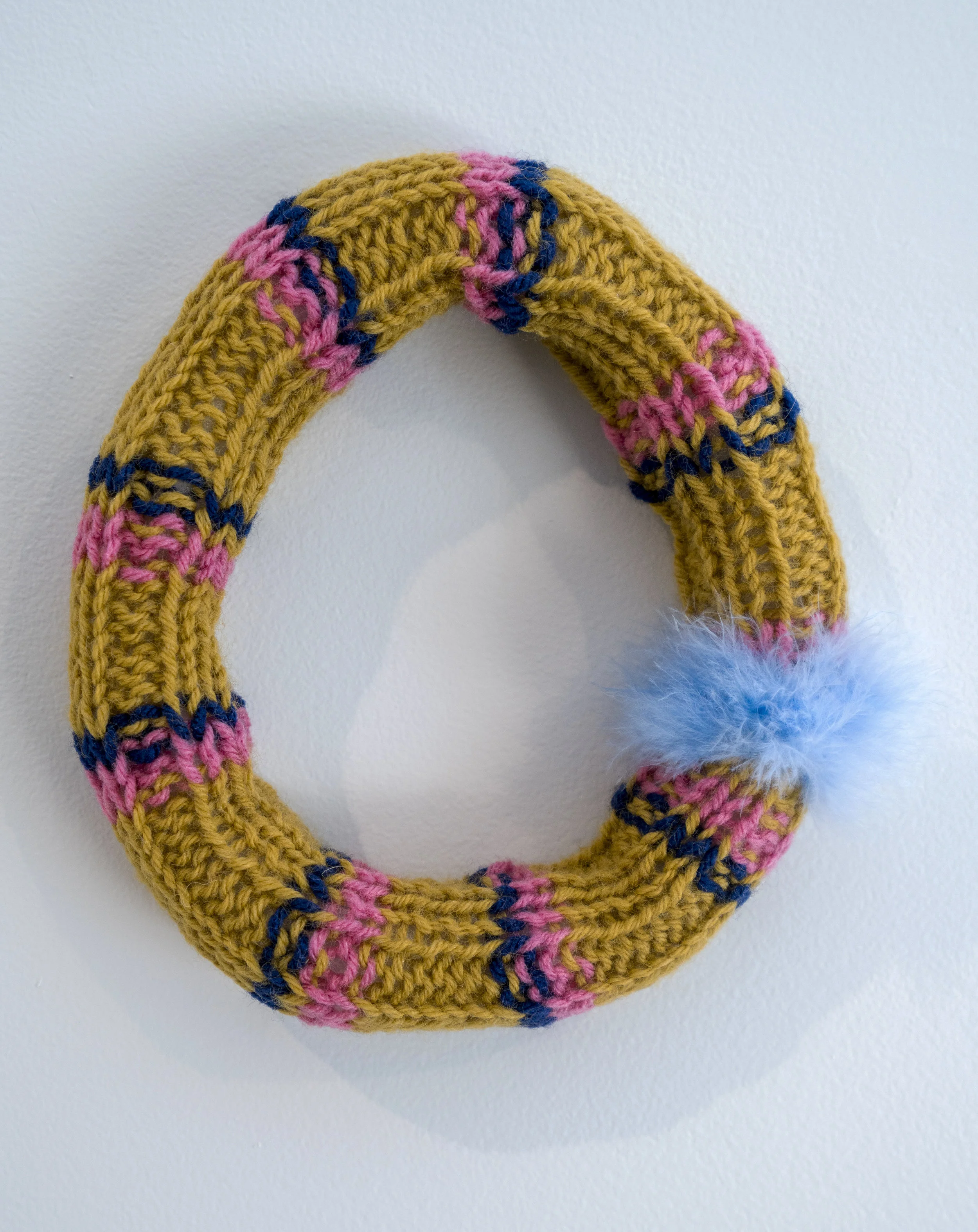 Ring around the rosie 2016 Wool yarn, acrylic yarn, acrylic stuffing, feather down. 8" x 8"