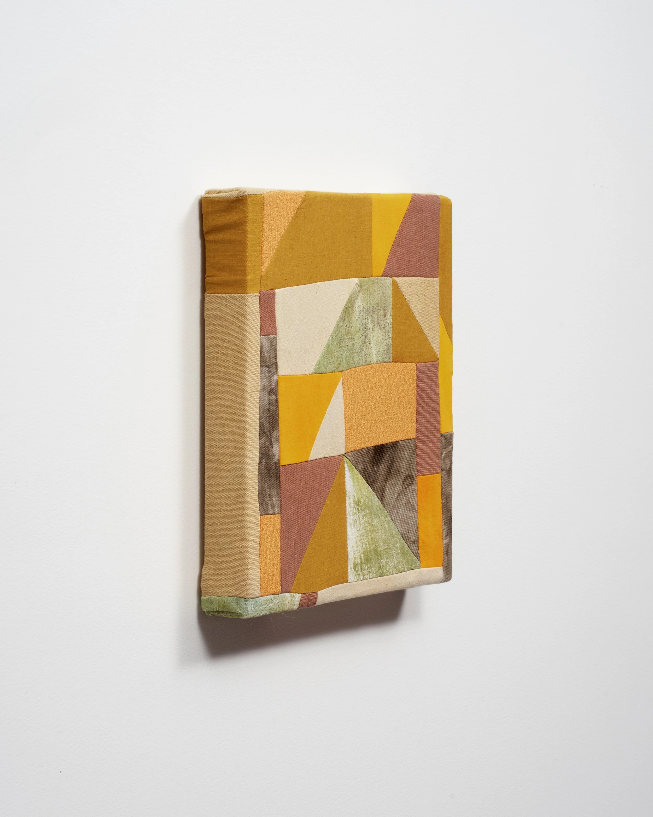   Sundazed (side view)   Canvas, flannel, poplin, wool, marigold, iron, and acrylic paint.  10” x 11”  2025  Photo: Jay Stern  
