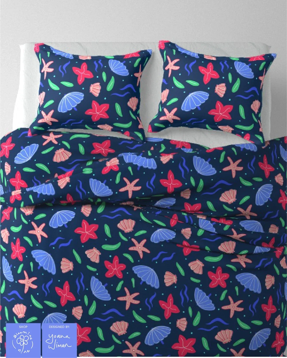 Children's bedding sheet set using a surface pattern with hand drawn sea shells parasols and flowers found in the summer by the beach