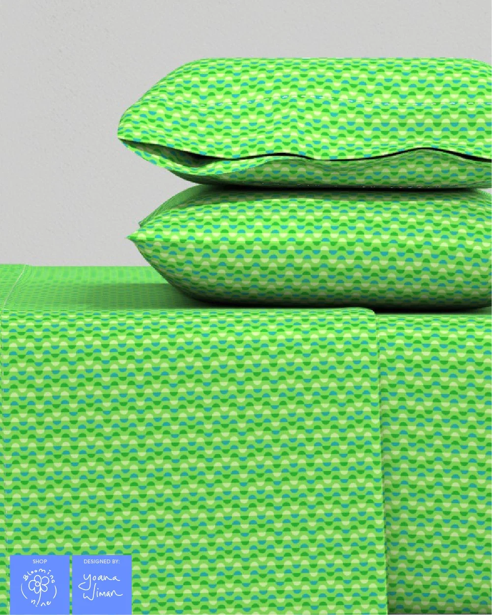 Small hand drawn semi circle crescent shapes in neon greens and yellows create a kaleidoscopic and optical effect on this bedding and sheet set.
