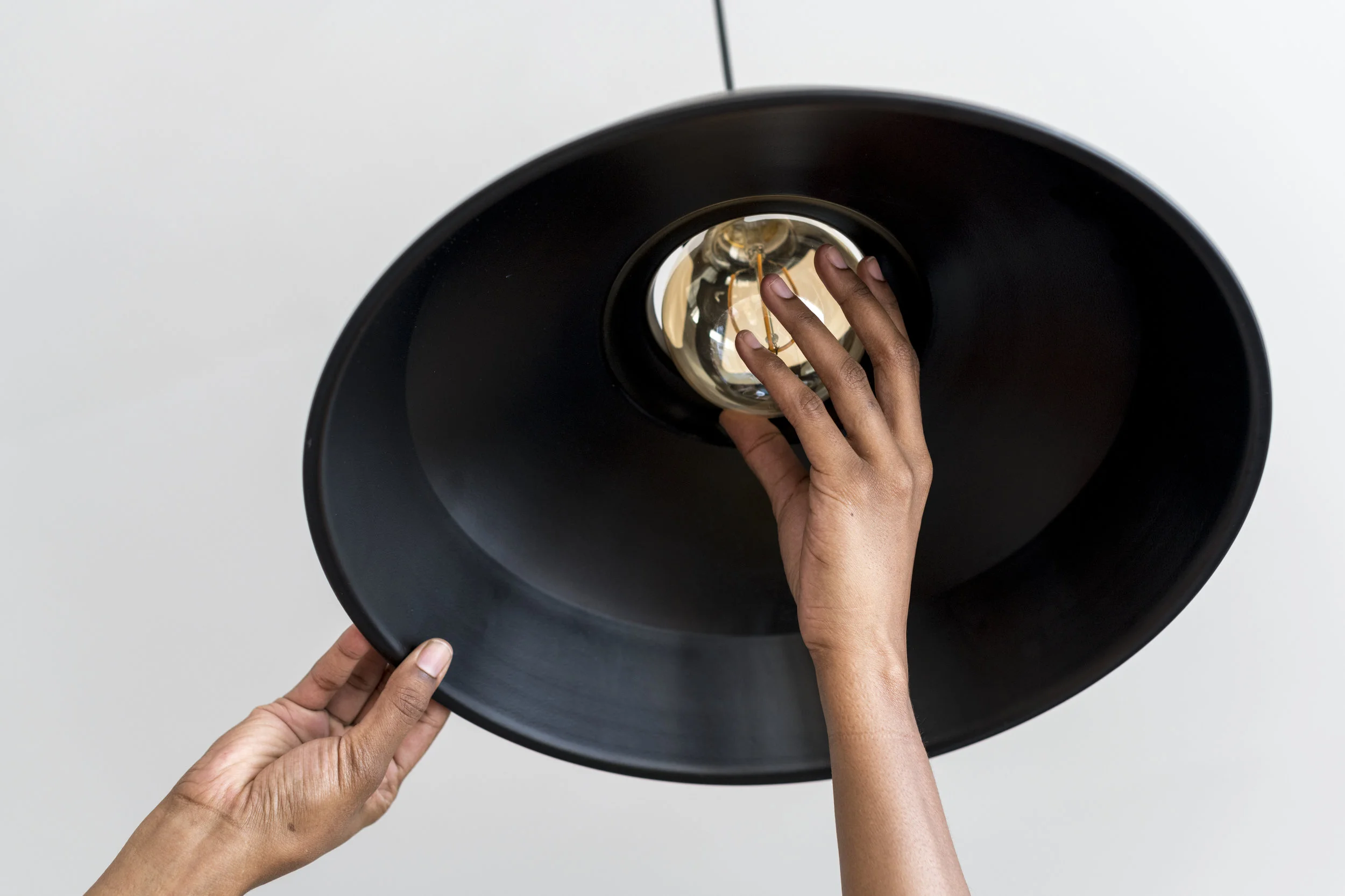 Woman changing ligh tbulb