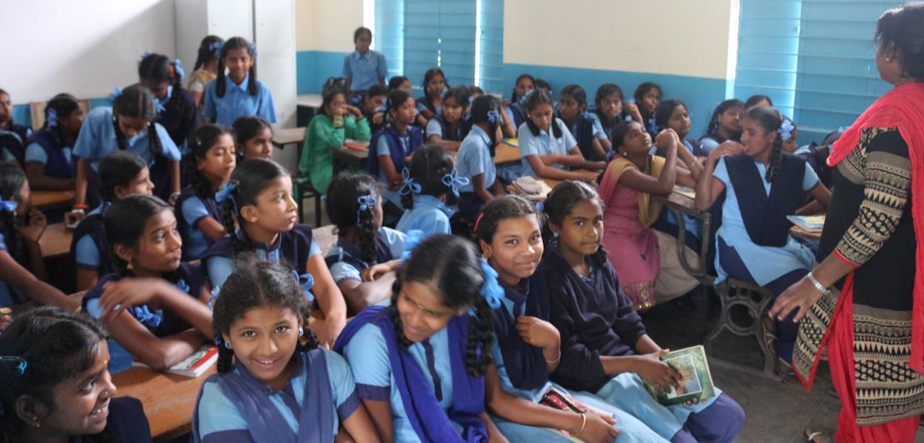 Girls at a local school receiving community education on the risks of exploitation.