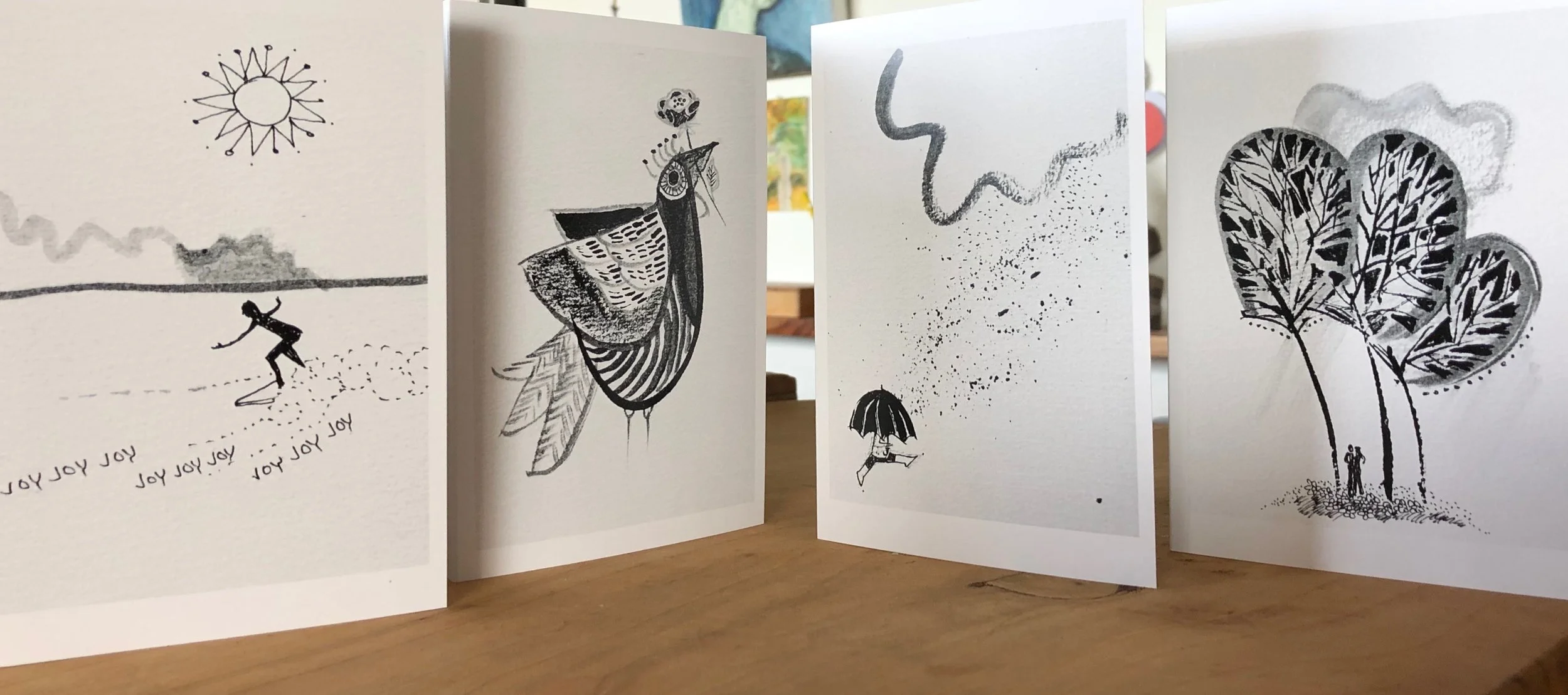 Four of 32 new card designs