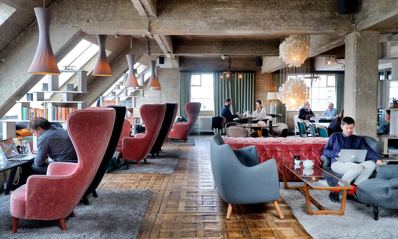 Converted warehouse Sitting Room featuring Tom Dixon furniture and a mixture of antique and contemporary light fixtures. Shoreditch House, London