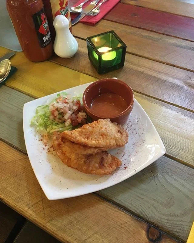 Come to Amigos for our homemade Smoked chipotle pulled chicken empanadas, which are smoked in our in-house smoker