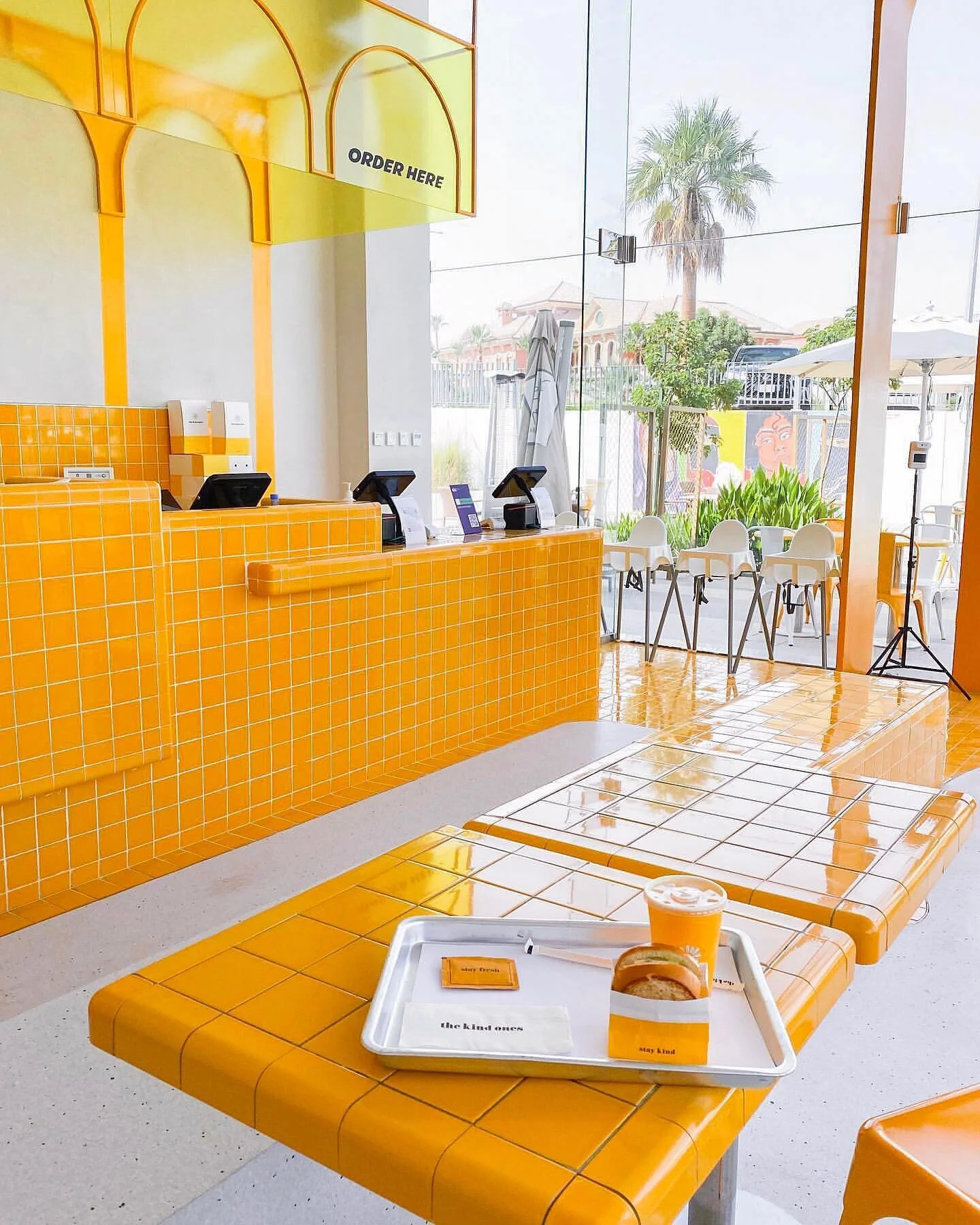 Counter space of the restaurant &ldquo;the kind ones&rdquo; reflecting its branding through curvy shapes and curvy yellow sunny tiles. @thekindones @thekindonesksa #dreamspace 
#ihavethisthingwithyellow #restaurantdesigner