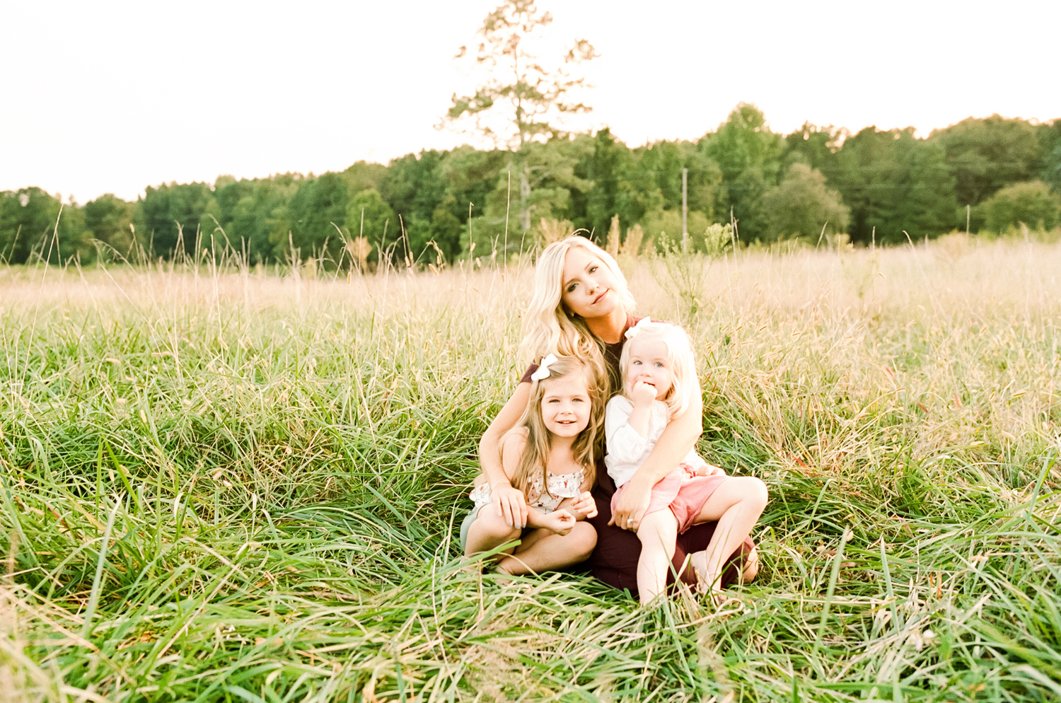 lifestyle-family-photographer-field-sunset-raleigh-holly-springs