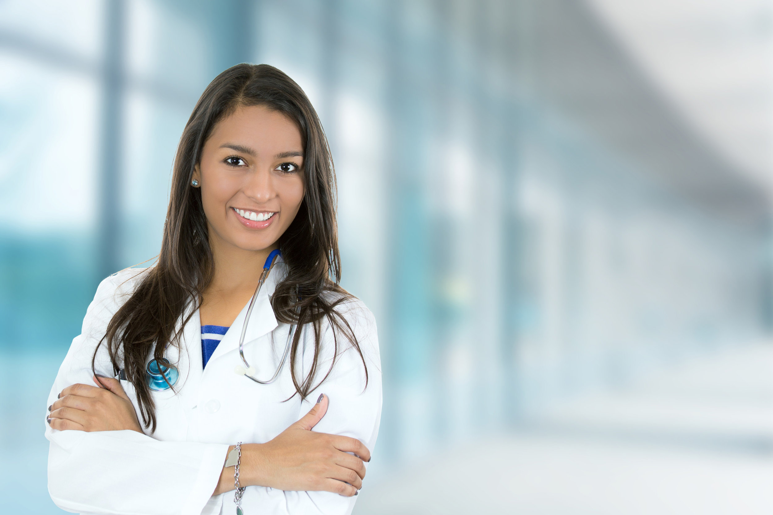 Confident young female doctor medical professional in hospital.jpg