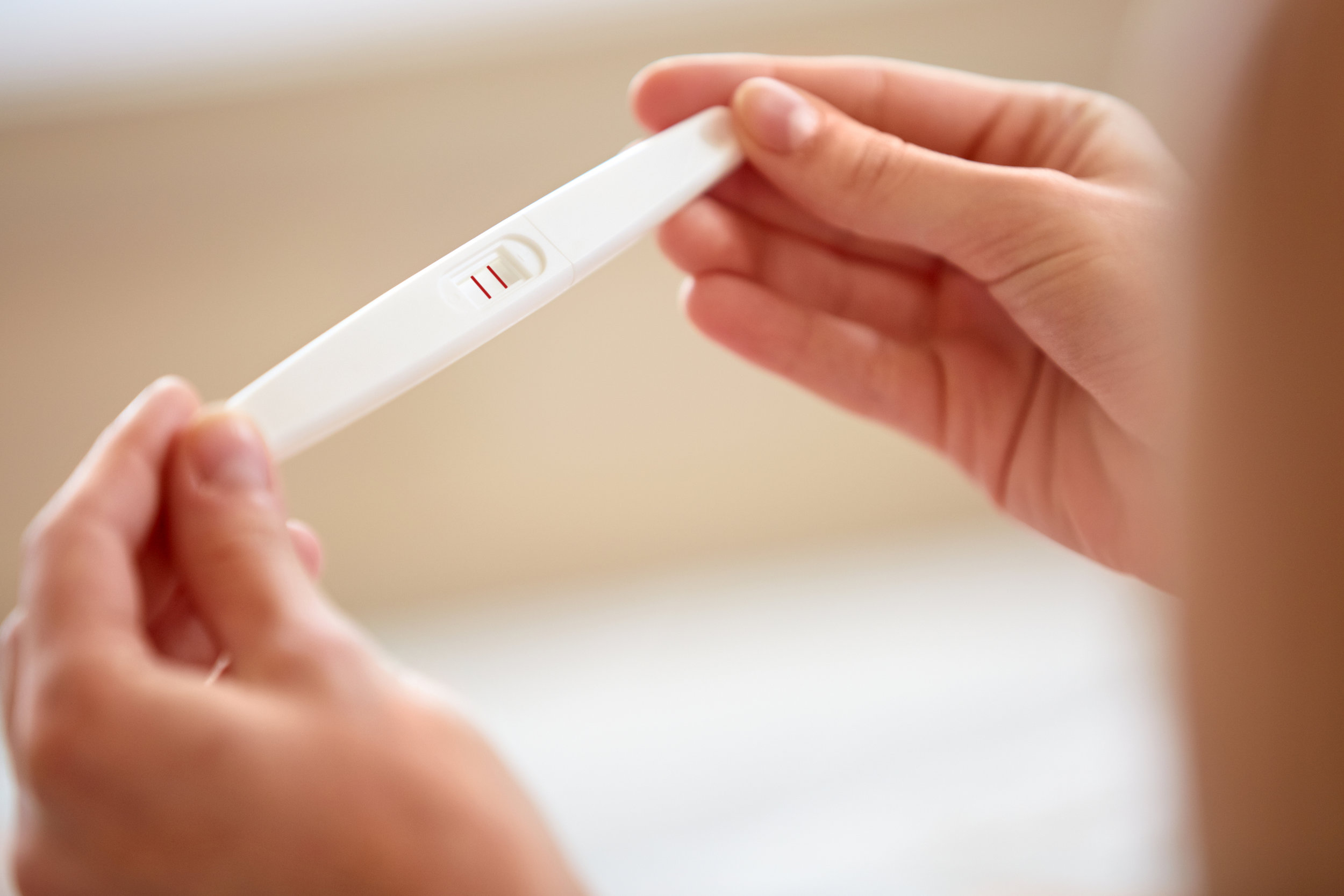 Woman Holding Pregnancy Test. Pregnant..jpg