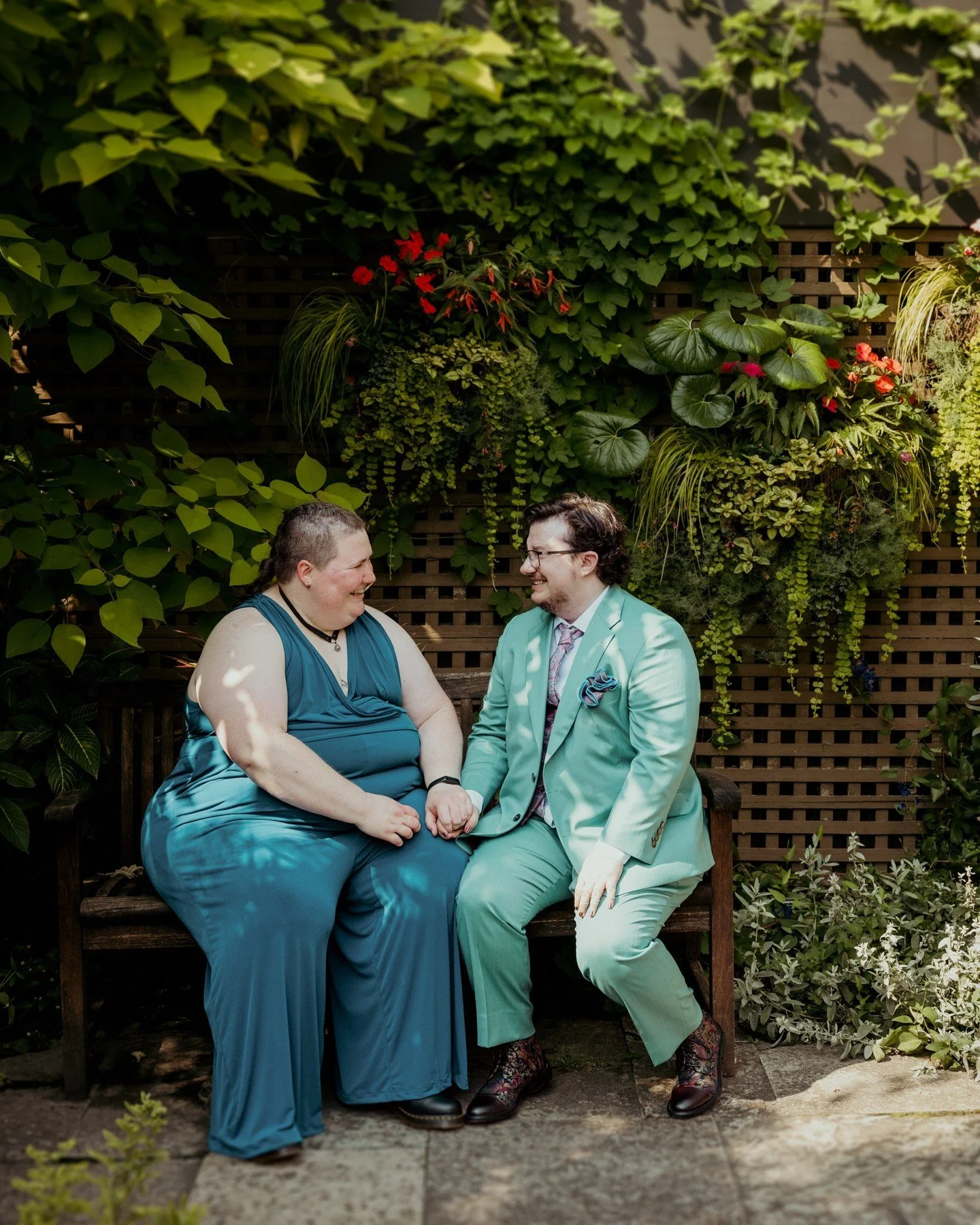 This sweet moment between Gretchen (they/them) and Max (he/him) at @olbrichgardens is EVERYTHING. It's got all my favorite stuff - queerness, greenery, hand-holding, you name it! 😍 Congrats again to Gretchen + Max! 🏳️&zwj;🌈🏳️&zwj;⚧️💜
.
.
.
.
.
.