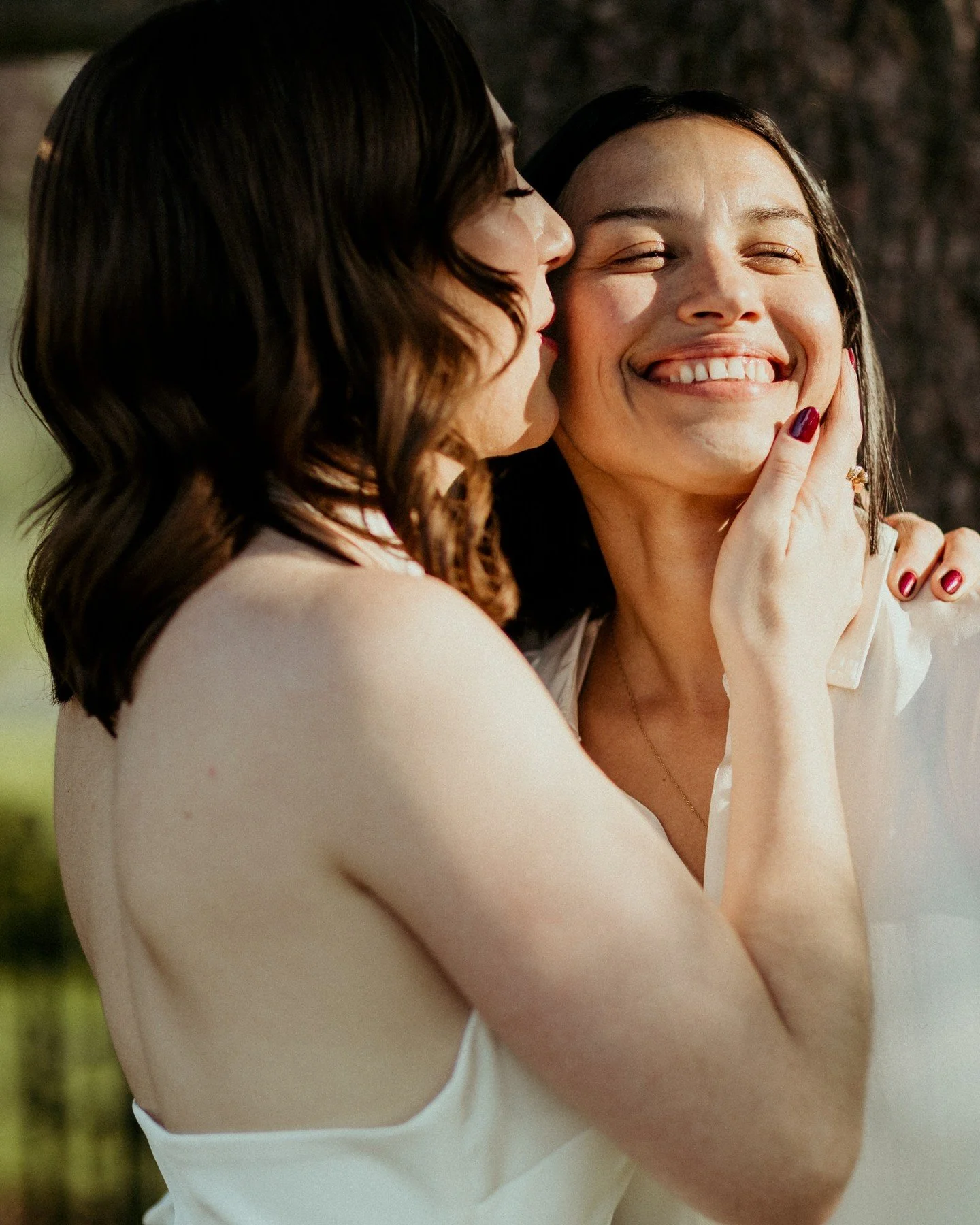This photo of Erika kissing Alba, with the late evening sun streaming in, is breathtaking and it's one of my favorites from their wedding day! Just a friendly reminder to hire a photographer who enthusiastically celebrates your love! 🏳️&zwj;🌈❤️
.
.