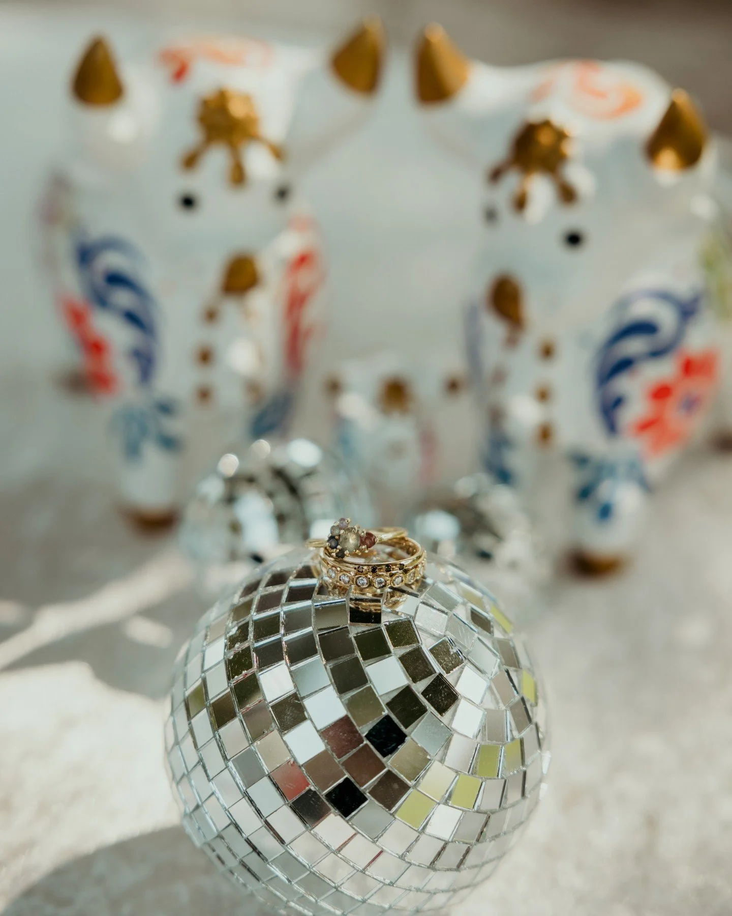 The little details of a wedding day matter, especially the kind that blend the cultures and personal lore of each member of the couple. I love these adorable little hand-painted bulls from Erika + Alba's wedding day (the little one represents their a