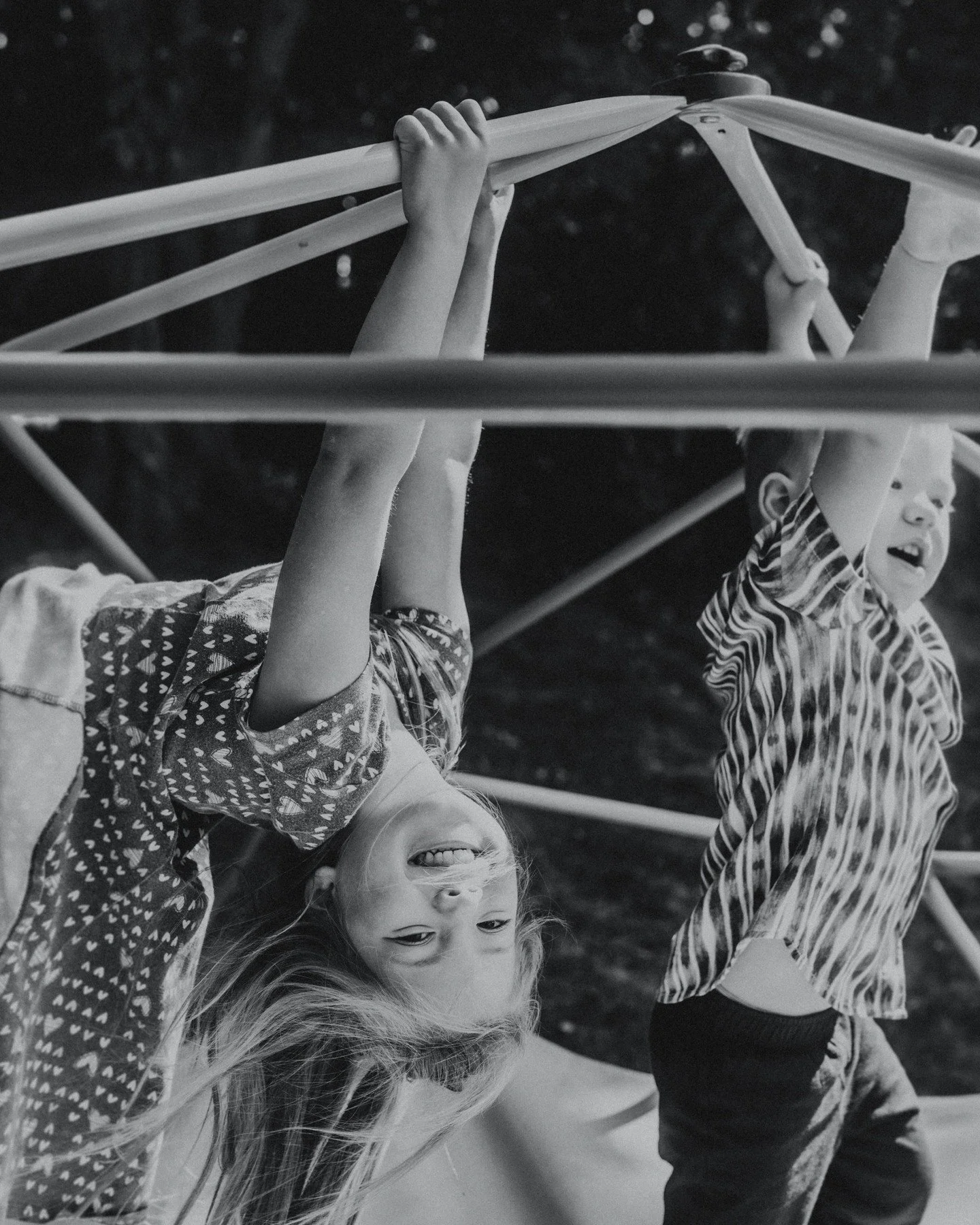 It's okay to let kids be kids during your family portrait session! Not only will your kids be happier, but also, aren't these the moments you want to remember anyway? 🥰
.
.
.
.
.
.
[Image Description: A black &amp; white image of two white children,