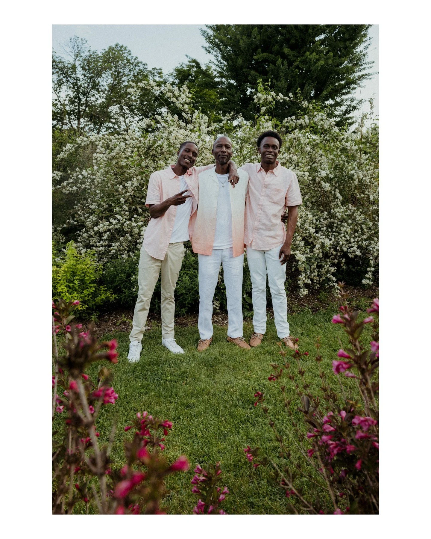 Dads, this is your sign to get more photos with your sons and stepsons 💜 You won't regret it! Love the photo of these three guys at the gorgeous UW Arboretum! 
.
.
.
.
.
[Image Description: Two young Black men stand on either side of another Black m