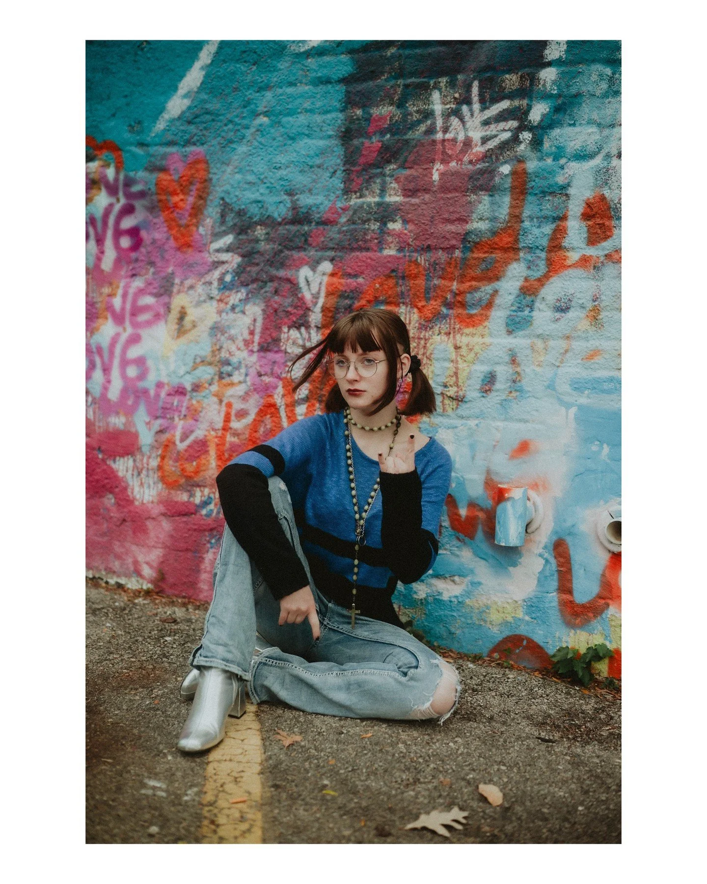 Queer &amp; trans kids deserve to be cherished, supported, and protected. Always. 🏳️&zwj;🌈🏳️&zwj;⚧️
.
.
.
.
.
.
[Image Description: A white girl who is a senior in high school is wearing a black &amp; blue sweater and ripped light-colored jeans wi