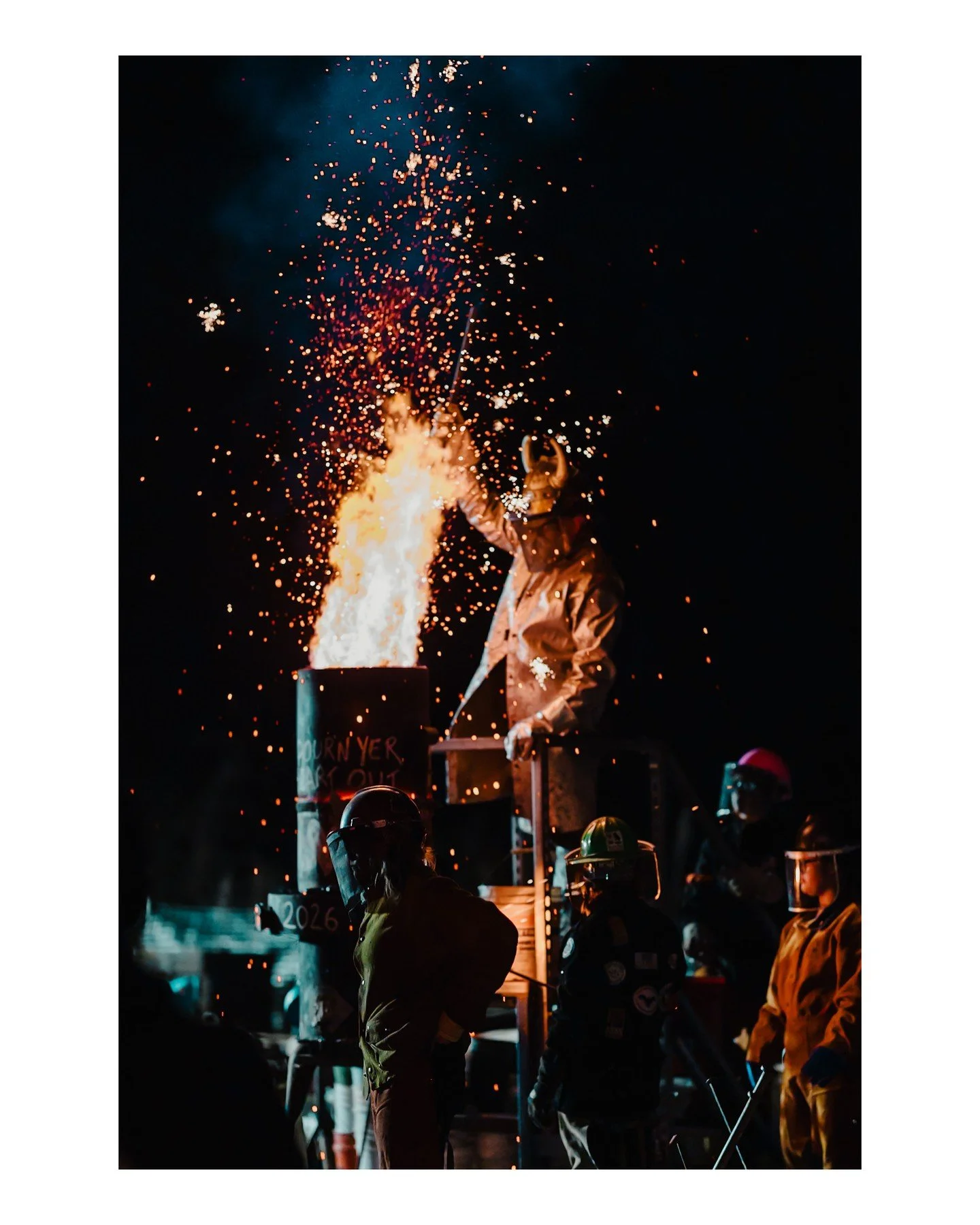Speaking of real life magic ✨ .... AI could never 🚫
.
.
.
.
.
[Image Description: A person wearing protective gear, including a horned welding mask, is stoking the furnace ahead of an iron pour. The scene is nighttime, and there are people milling a