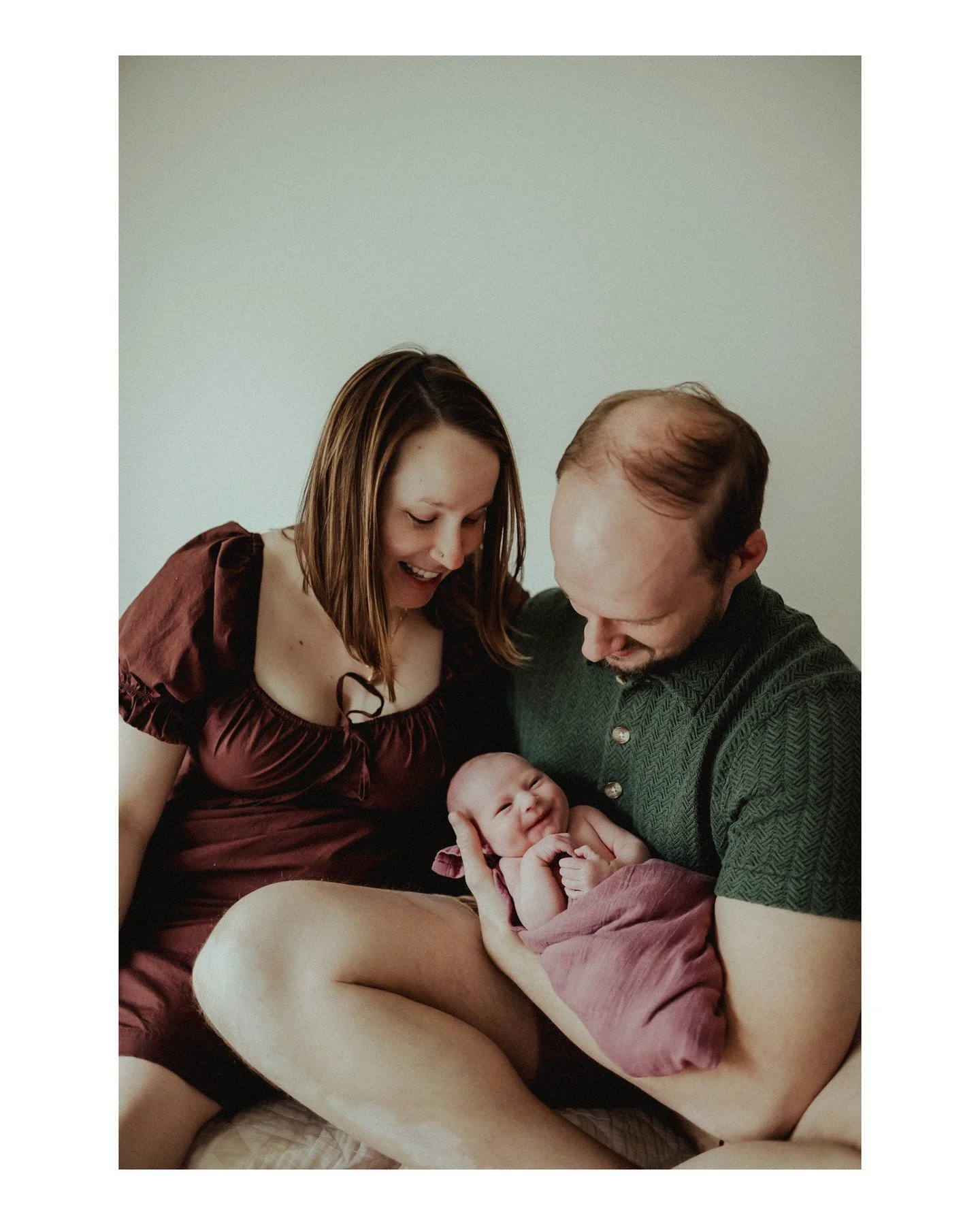 Ann + Sam welcomed their wee one and we got to spend some time on Friday taking pics to celebrate! Also, I *logically* know that newborns can't smile at that age, but.... LOOK AT THAT TINY SMILE! 
.
.
.
.
.
.
[Image Description: A white woman with st