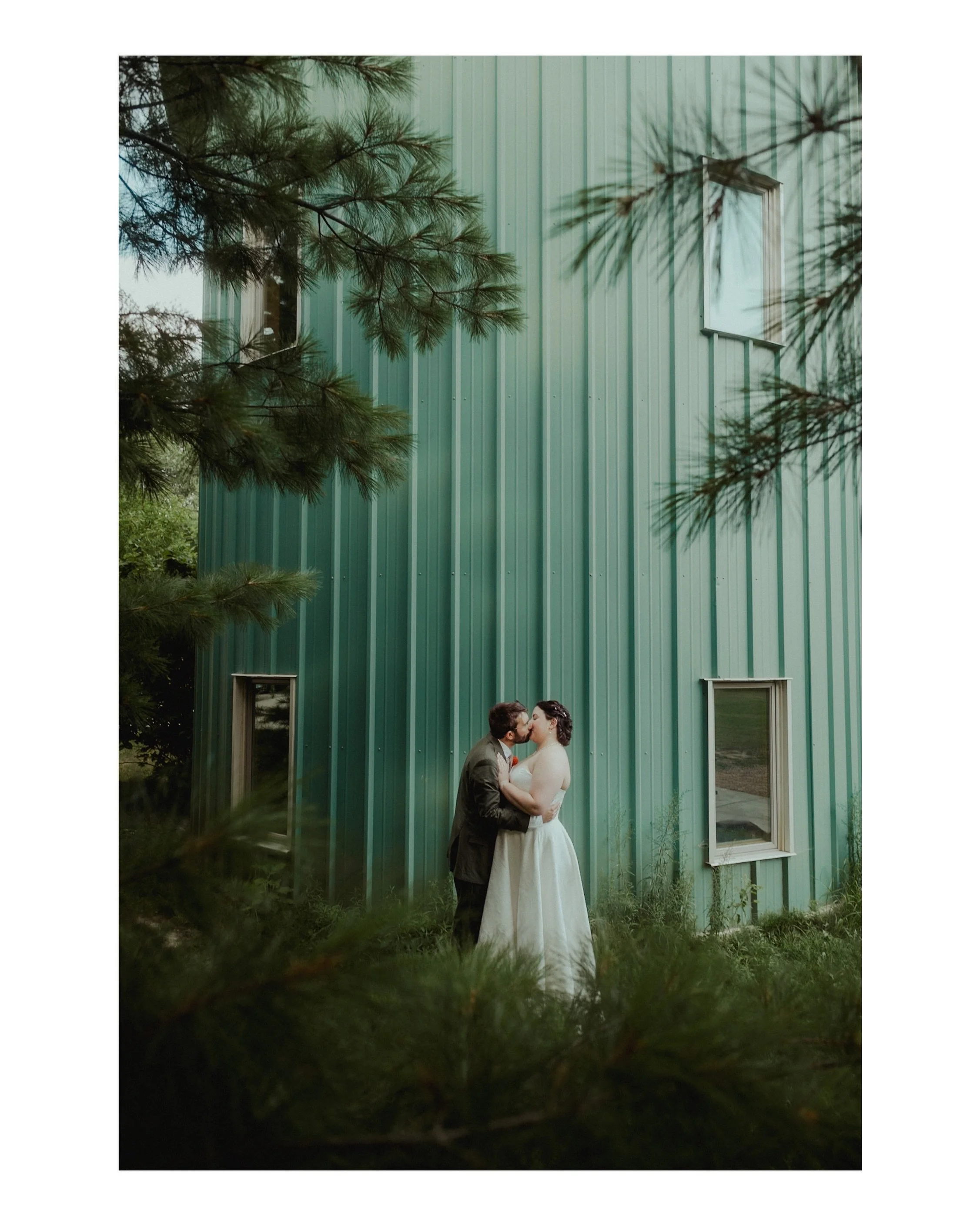 Sometimes the setting just WORKS. This gorgeous spot at the Aldo Leopold Nature Center during Lena + Andrew&rsquo;s wedding was the perfect spot to snag some couples photos! Get you a photographer who can see the beauty in a corrugated building 😍
.

