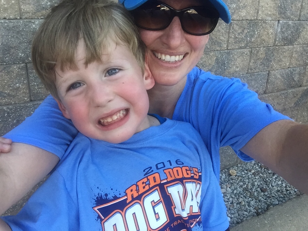 My son and I posing in our Lawrence, Kansas Dog Days T-shirts. We earned the shirts after completing 25 workouts this summer!