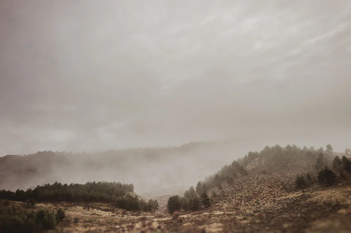 Fog emerging on top of the mountain
