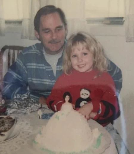 My father and stepsister celebrating her birthday.