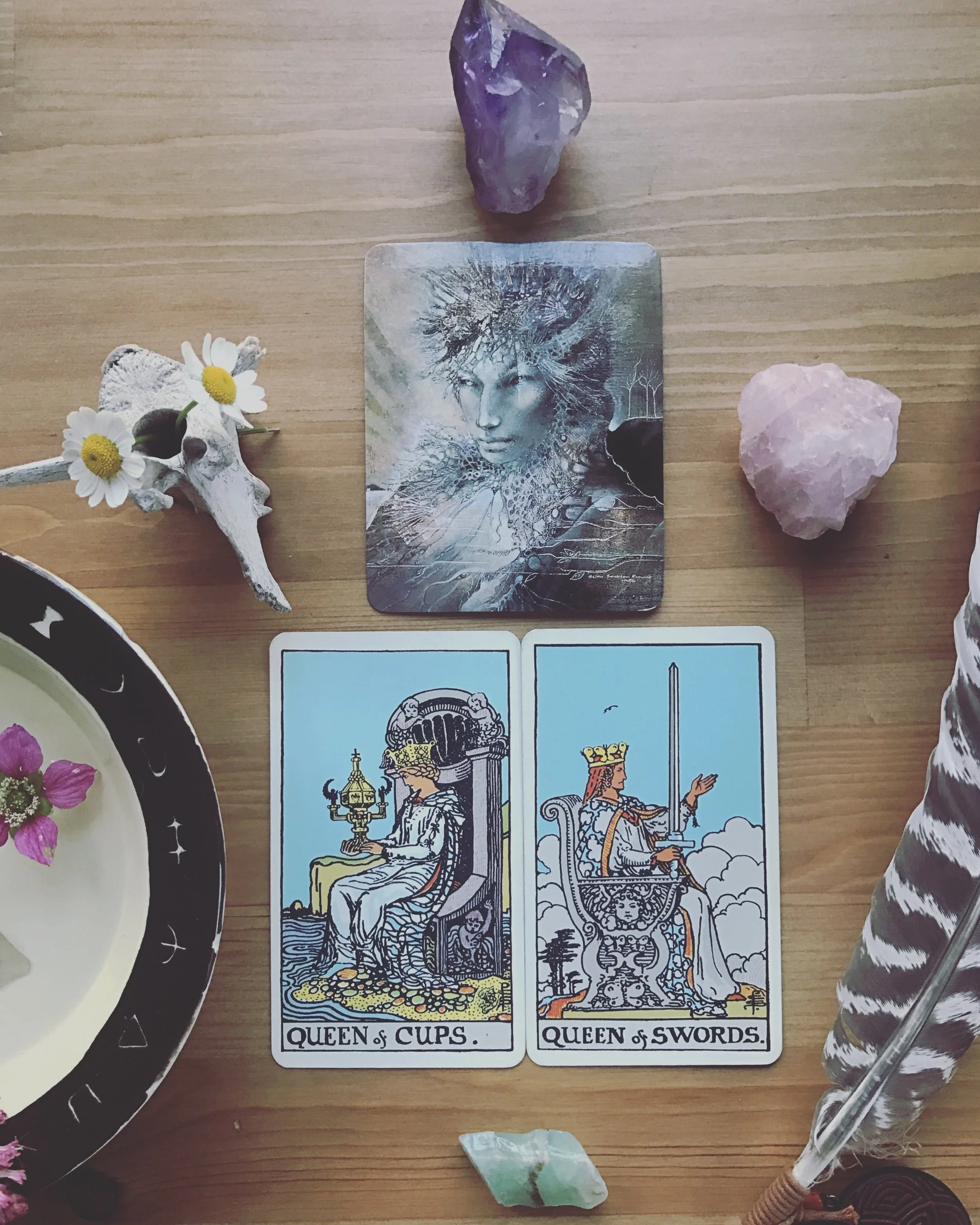Wishing you all a beautiful new moon in Aries, occurring this evening. Aries is full of passion and fire, able to step into action without second guessing or overthinking. And damnnnnn do some of us need that energy in our lives (me, for one). For those who are in touch with their fiery selves, today’s draw brings wisdom in balance for you as well. This morning we are given the queen of cups and the queen of swords, back to back. They may be facing away from one another, but I see these two working together, making sure to have a view of both sides. They have each other’s back. Artemis watches from above them, a reminder to be grounded in this wild earth and to bring fuel to their independent natures. Patriarchal culture (in which tarot was created too) likes to draw a line between logic and emotion, the intuitive and the analytical. But as we are learning more and more, binaries aren’t about lines: they are circles and spectrums, cycles and waves. Our intuition obviously aids our analysis and logic can teach us quite a bit about our emotions. These aspects of ourselves interact and inform one another throughout our daily thoughts and expressions. They are not in separate boxes. As our energy shifts with the seasons and the planets, let us utilize both our logic and our intuition. This combination grants us some fierce, feeling, intelligent, and wild energy. Let us channel it into our creativity. Allow it to guide our actions. May we revel in ourselves, one another, and the glory of being alive and able to act, able to create, able to analyze and think. Let us follow our intuition into action and allow our wit to inform us along the way. Let us be active in our connection to our bodies, our planet, and our compassion for each other and the fate of this world. Let us be centered, have one another’s back, and continue to allow all four elements be present in our creative endeavors, in the actions we take, in the love that we make, and the connections we form. Love and healing to all. Blessed be.