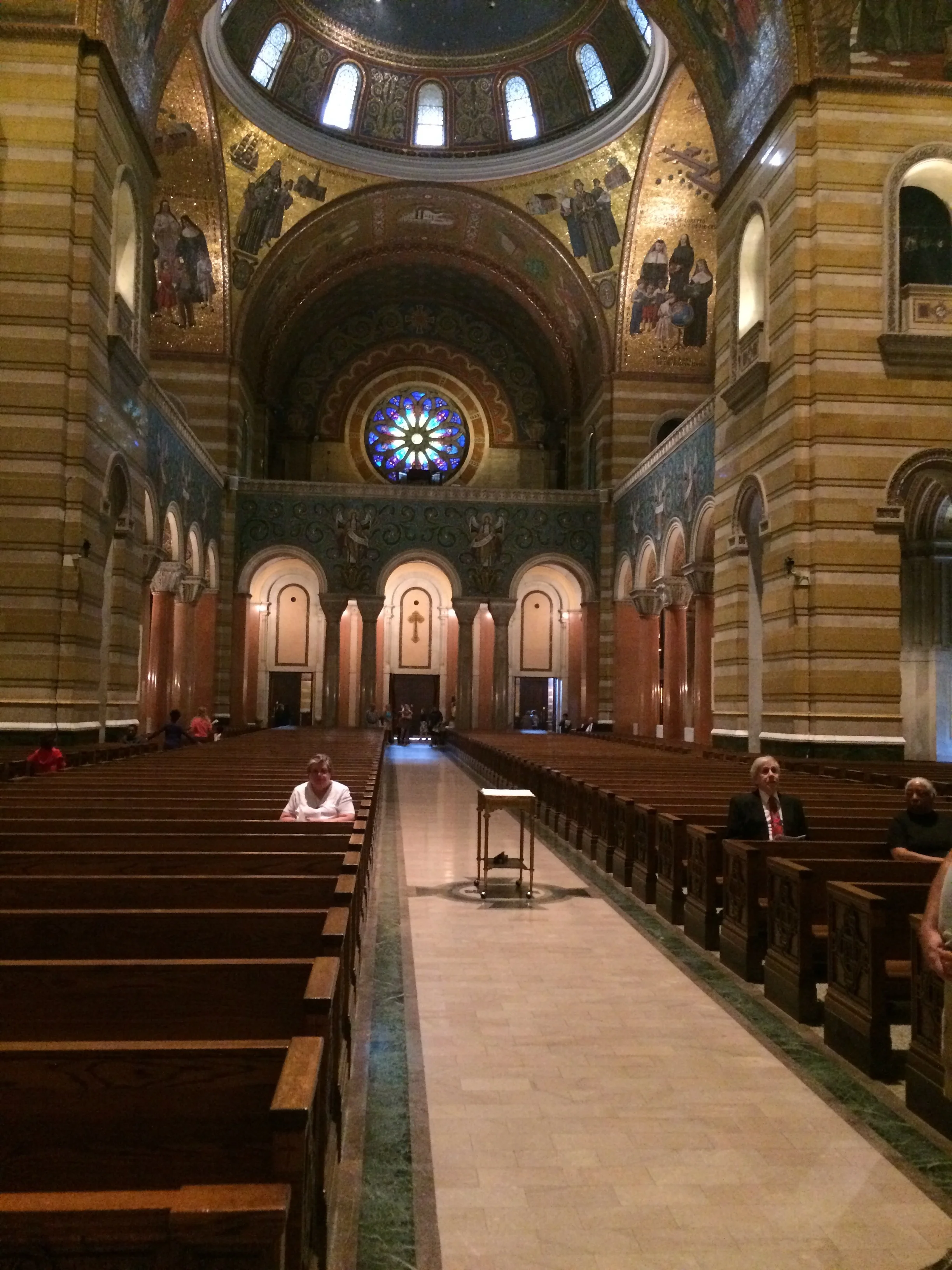 Worshipers start to gather for the next mass.