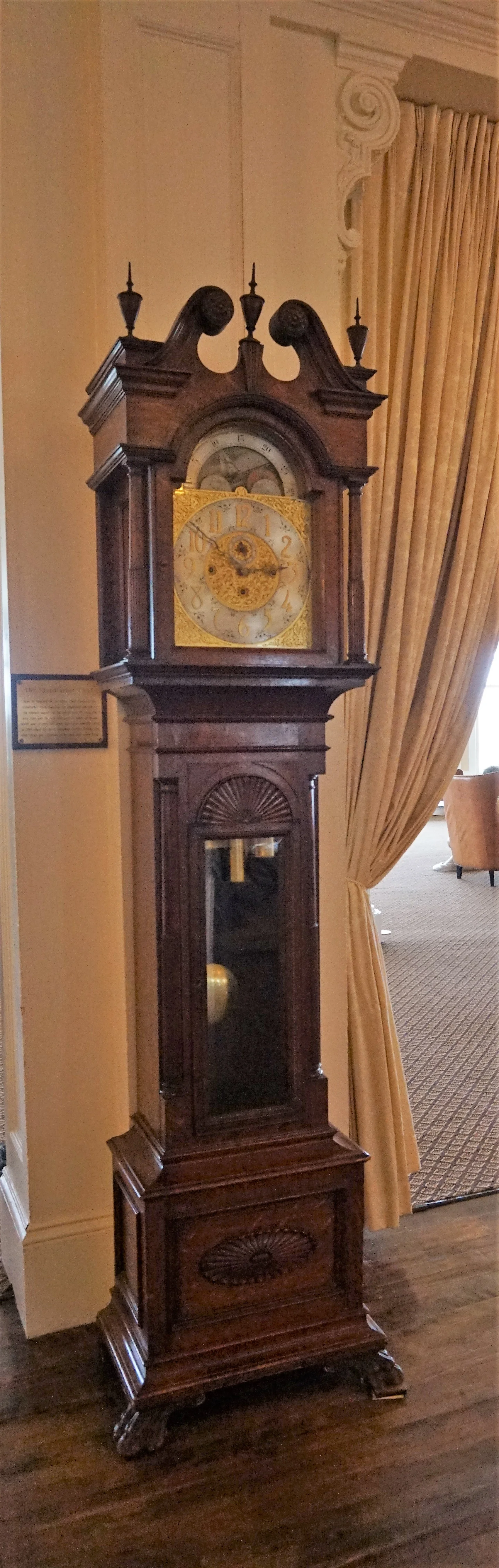 The face of the clock is made of separate 14-karat gold pieces, and the dial at the top shows the 29 days of the moon's phases.