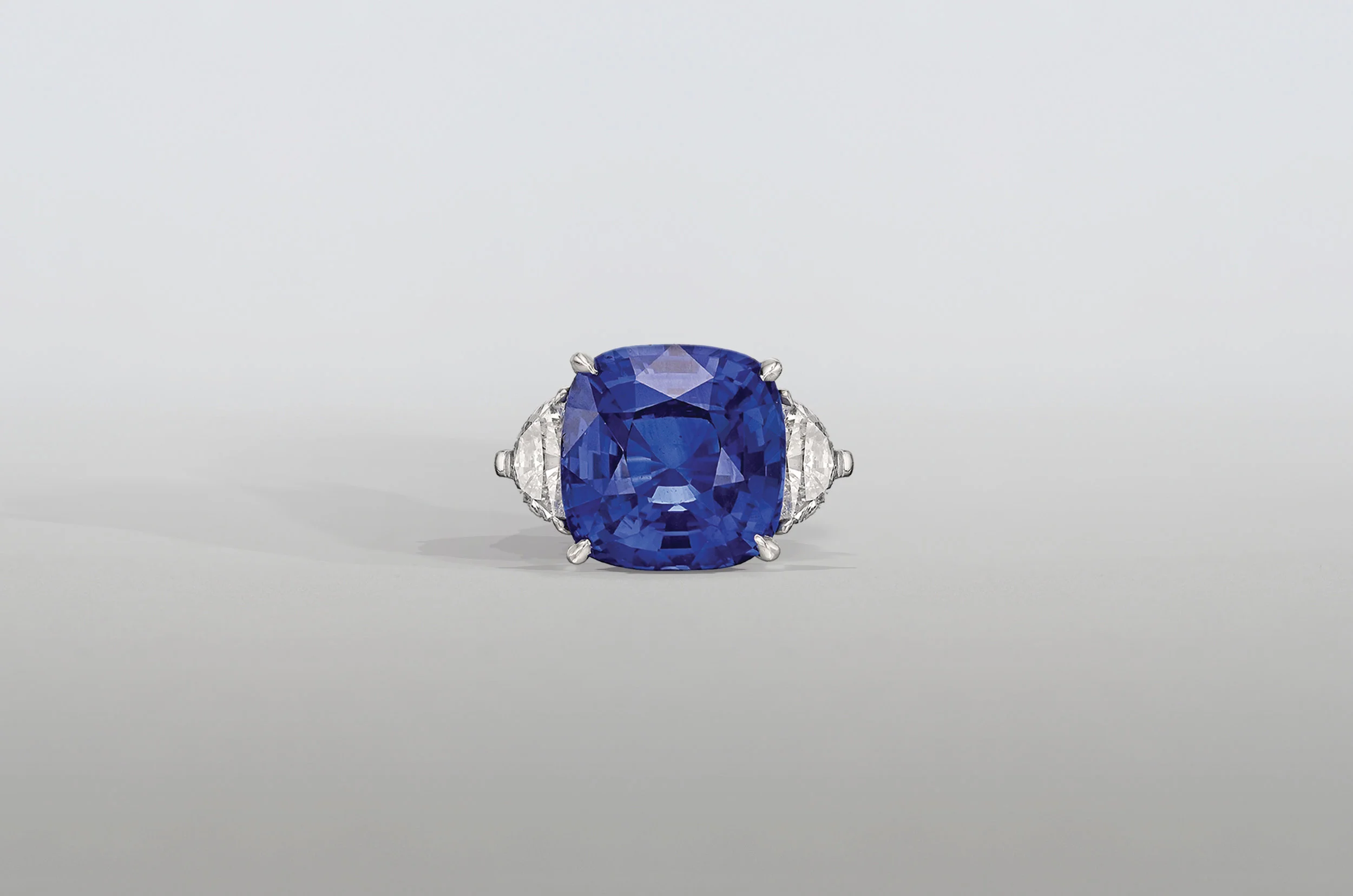 8.5 Carat Cushion Sapphire Ring with Trillion Diamonds set in Platinum