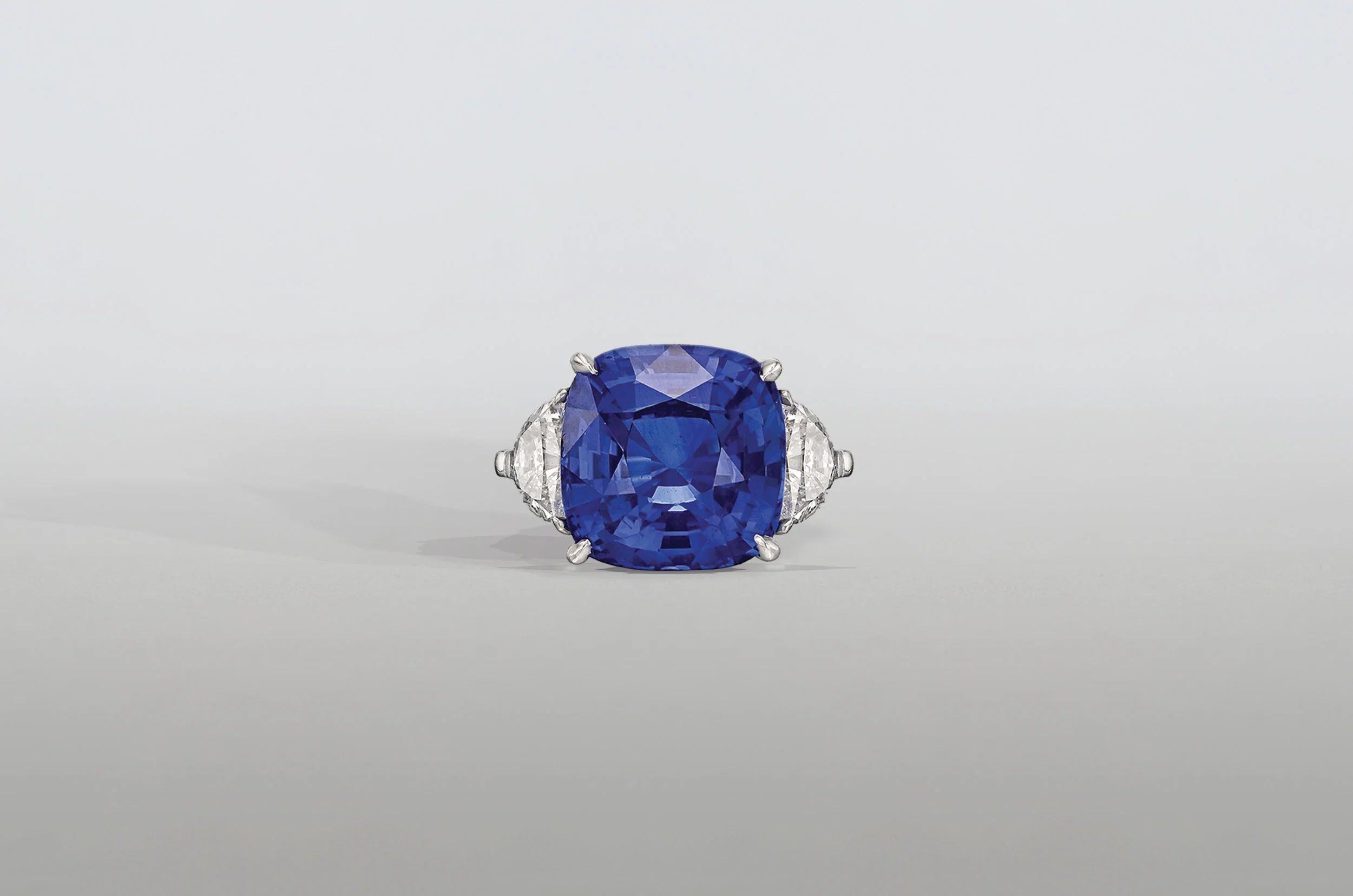 8.5 Carat Cushion Sapphire Ring with Trillion Diamonds set in Platinum