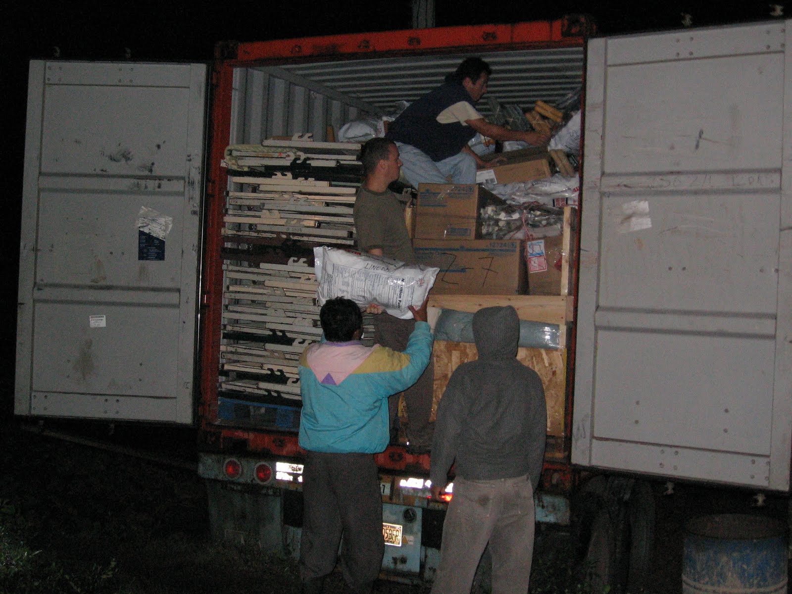 BVC Coban 2009 Pat Deering unloading container.jpg