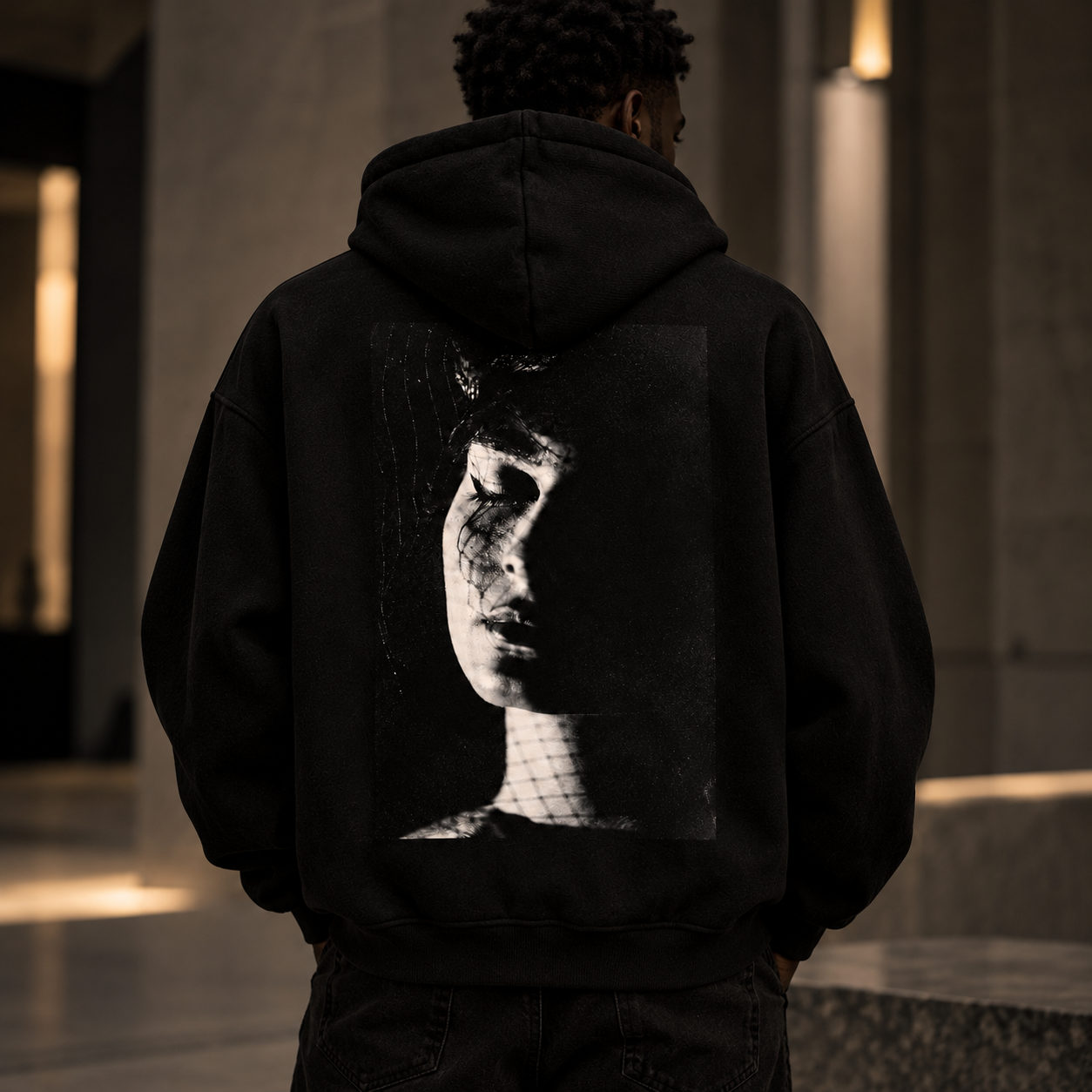 Cinematic Hoodie Portrait in Concrete Light.png