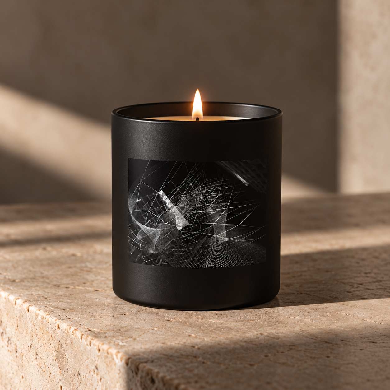 Moody Black Candle in Sunlit Stone Interior.png