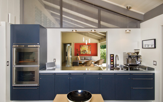 Entertaining is a snap with this large passthrough between the kitchen and the lanai area. PHOTO BY: HAL LUM