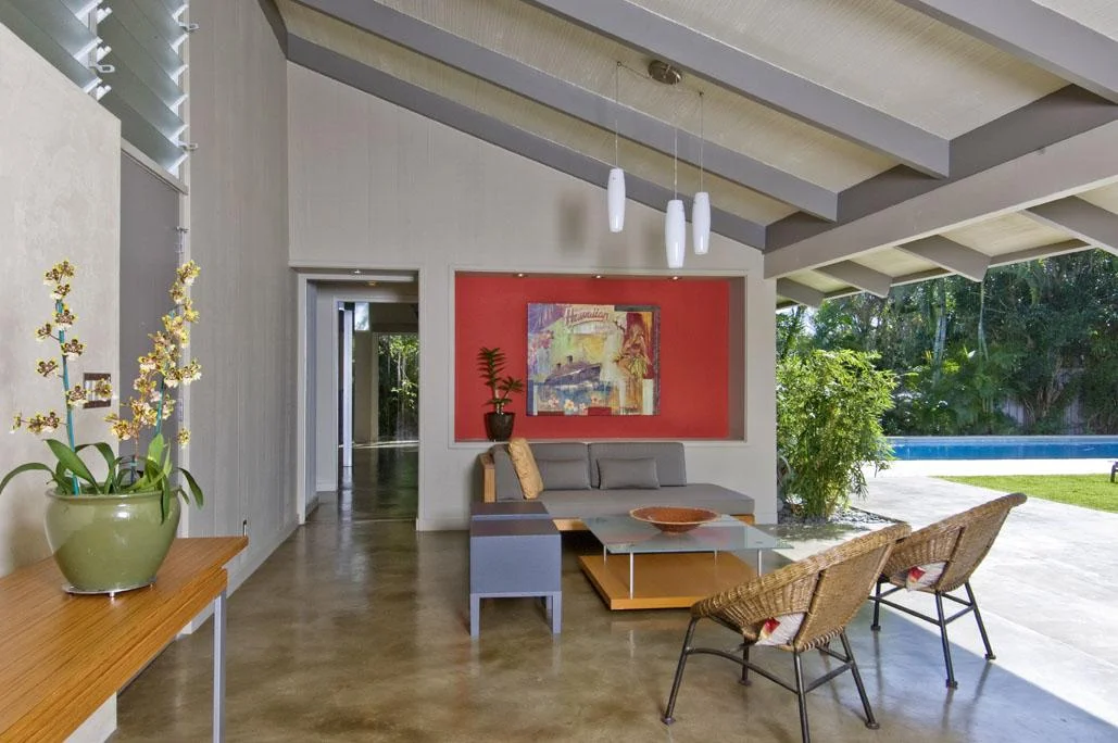 Walking through the front door leads directly into this covered lanai area—true indoor/outdoor living. PHOTO BY: HAL LUM