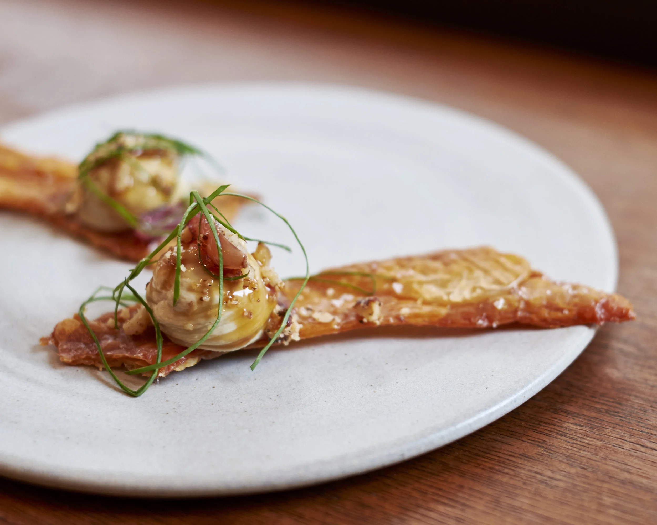 Crispy chicken skins, liver parfait, candied walnuts & muscat grapes at Portland, London. Photo: TACA
