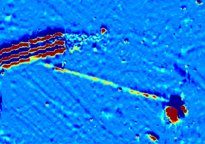 Abandoned septic drain field and pump station revealed by magnetic methods.