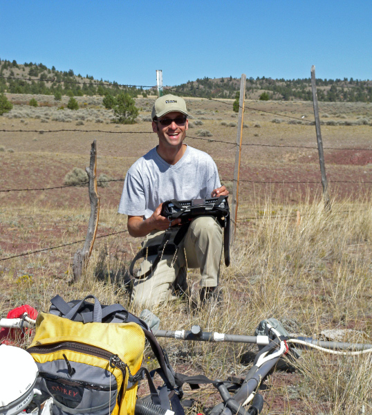 Joe readies the magnetometer for a magnetic survey.