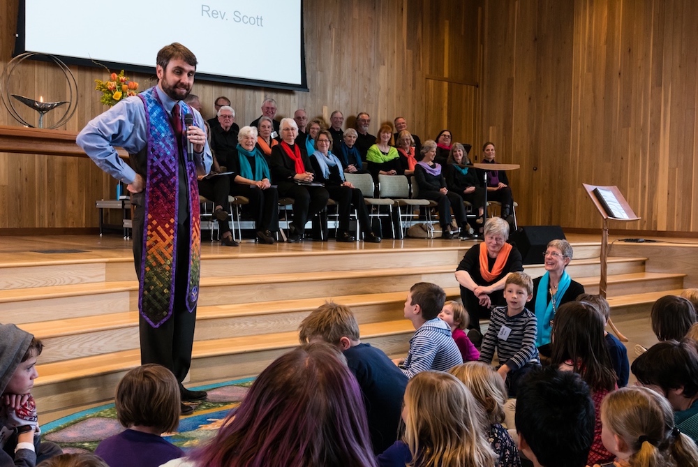 Rev. Scott Rudolph tells the children a story about love.