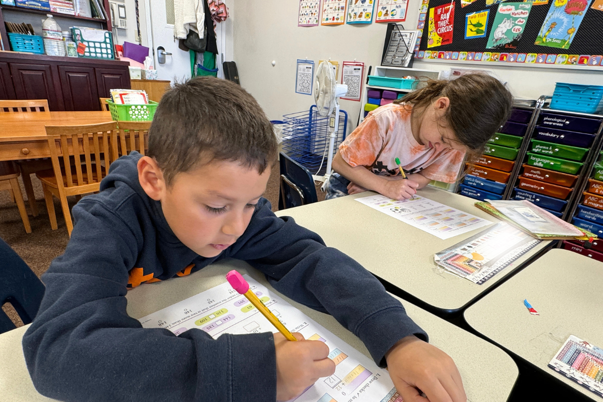 two elementary school students at desks